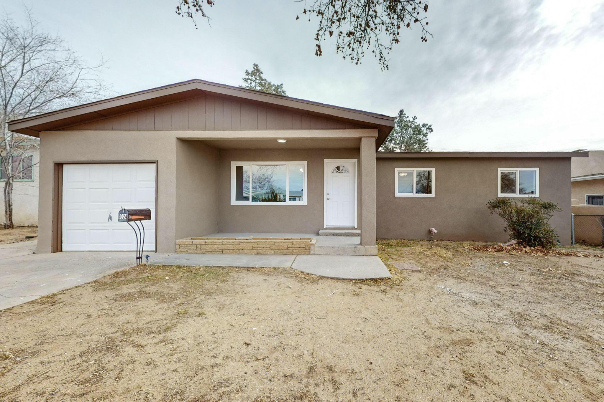 COME AND SEE THIS BEAUTIFUL HOME IN NE ALBUQUERQUE. Property is practically a new build located in an established neighborhood. Home has complete updates throughout, new HVAC, electrical, plumbing, windows, stucco, paint, and flooring. The kitchen is any homeowners DREAM, with a HUGE granite top island that is great for entertaining. Home has that 'open concept' feel that you will not find in this area of Albuquerque anywhere! The primary bedroom is also AMAZING with his and hers closets, as well as a shower that belongs in a model home! Outside has a HUGE backyard patio, as well as trees that make it nearly completely shaded. This home truly has it all, BRING YOUR BUYERS.....WILL NOT LAST LONG!