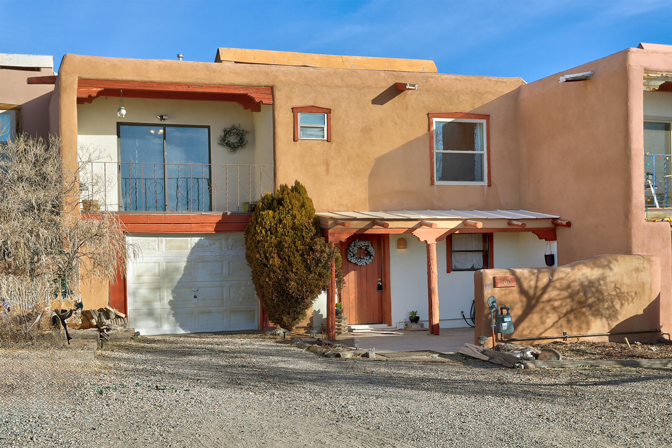 Nestled in the charming village of Corrales, this two-story townhome offers a perfect blend of comfort, style, and breathtaking natural beauty. The home features two spacious bedrooms, with the primary suite offering stunning views of the Sandia Mountains that will make every morning feel like a retreat. The full bathroom is thoughtfully designed, and an additional half-bath adds convenience for guests.Step outside to a quaint, low-maintenance yard--ideal for soaking in the tranquil New Mexico landscape or enjoying a peaceful evening under the stars. Whether you're inside or outside, the panoramic views of the Sandias are ever-present, creating a serene backdrop to your daily life.Inside, the home is adorned with traditional New Mexican vigas, adding warmth and character to the