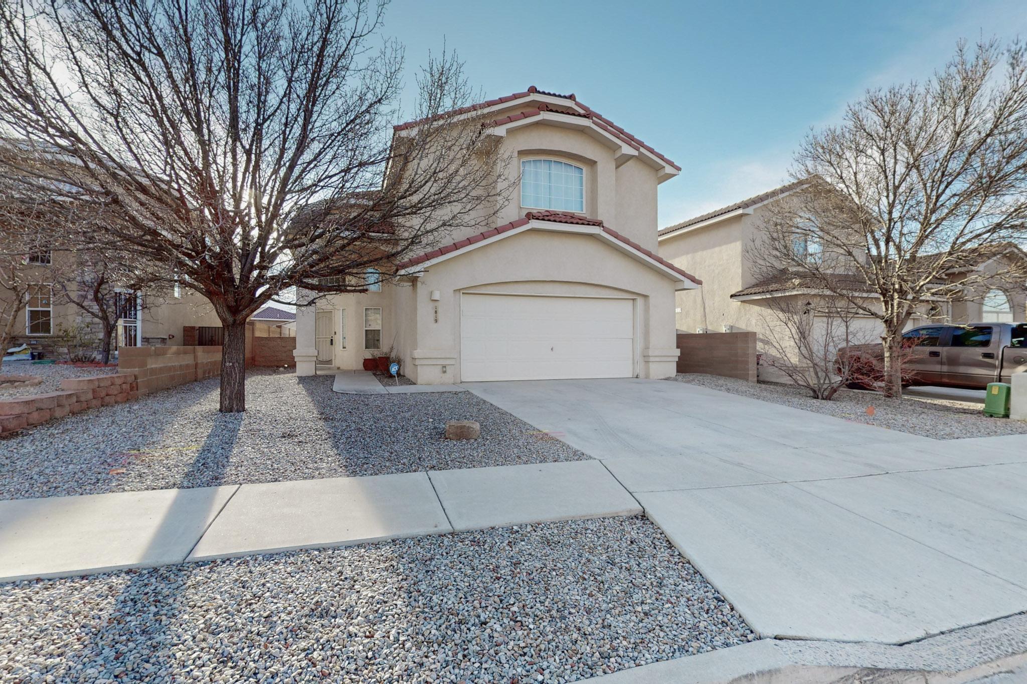 Spacious and stunning! This 4-bedroom, 4-bathroom home near Kirtland AFB, Sandia Labs, and scenic trails has so much to offer! The grand entrance features soaring ceilings and a striking staircase. The open kitchen boasts elegant cabinetry, stainless appliances, and a large island, flowing seamlessly into the living area with a cozy fireplace and gorgeous luxury vinyl floors. The luxurious master suite upstairs includes a peaceful retreat space, a garden tub, and a glass shower along with dual sinks. Additional perks include two living areas, low-maintenance yards, epoxy-floored garage with storage, no Public Improvement District, and an assumable 2.25% VA loan for qualified VA buyers. Don't miss it!