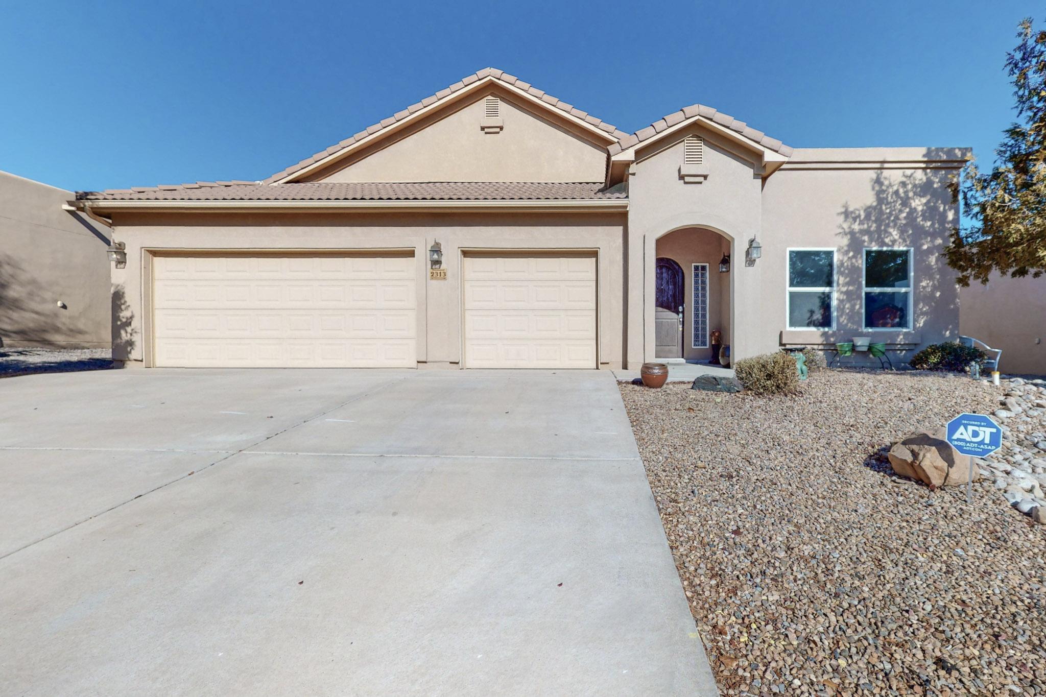 Step into this welcoming Rio Rancho home where comfort and style blend seamlessly. The main living area features a cozy fireplace and open floorplan.  The spacious kitchen is a chef's dream, boasting a double oven, upgraded refrigerator, and ample counter space.  There was a new roof installed in the summer of 2024.  Bonus water softening system for added comfort. The primary suite includes a fireplace, big bathroom with separate sinks, and a large walk-in closet with extra storage space, perfect for organization. A versatile bonus room can serve as an office, playroom, or additional living area. With an inviting layout, this home is perfect for entertaining or relaxing. Backyard is low maintenance with a covered patio.  Schedule your showing today!