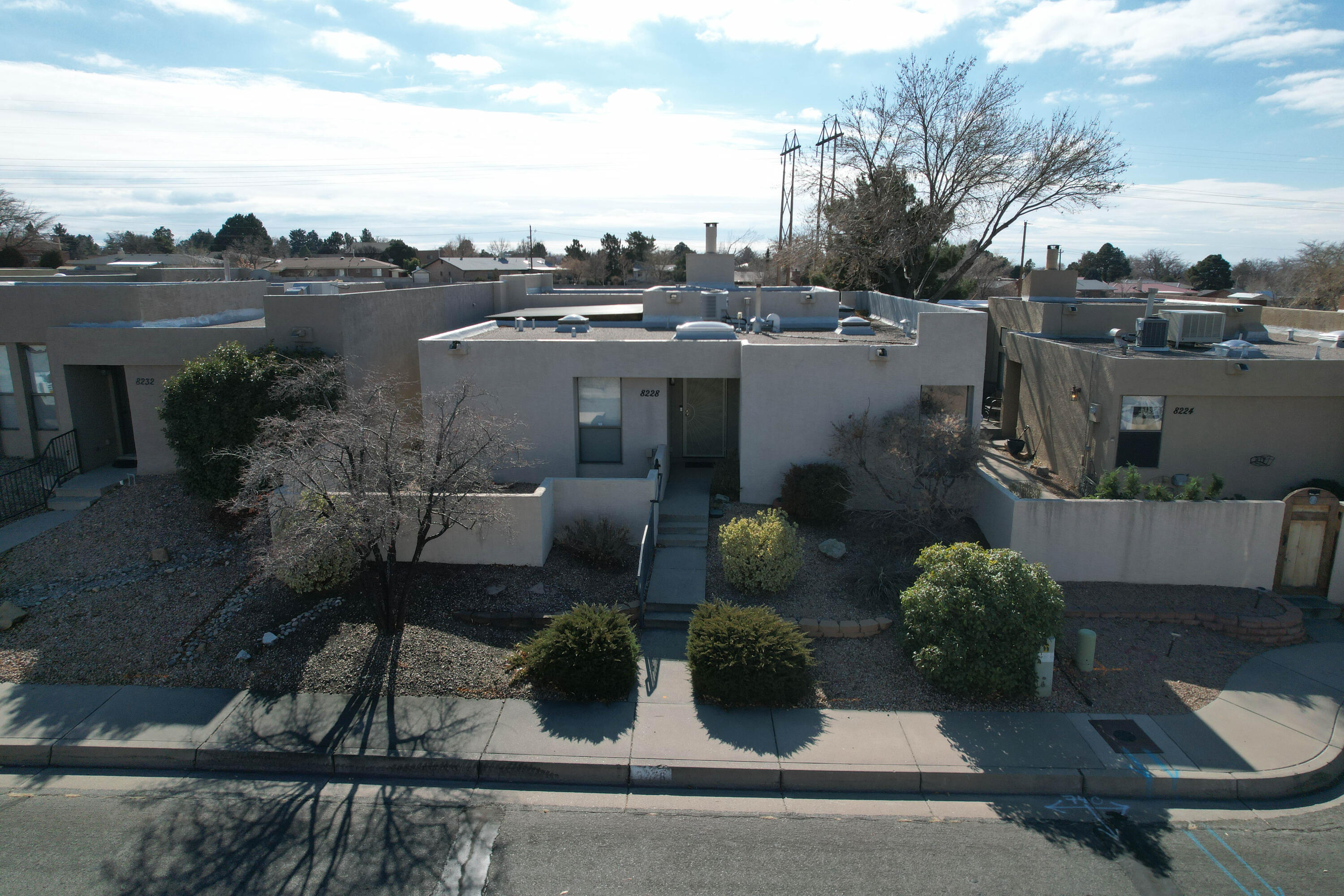 This beautiful East Albuquerque home is located in a prime location, offering both convenience and privacy. Situated close to all essential utilities such as groceries, schools, and shopping centers, this home provides the perfect balance between easy access to necessities and a peaceful residential setting. The house itself offers a unique and charming design, with a mix of Southwestern and modern influences. Inside, you'll find an open and airy floor plan, with large windows that flood the living spaces with natural light. The kitchen is equipped with modern appliances and leads out to a covered patio. Plenty of outdoor living space with a detached 2 car garage. This Albuquerque home is far from ordinary! come see for yourself!(Virtual video is virtually staged)