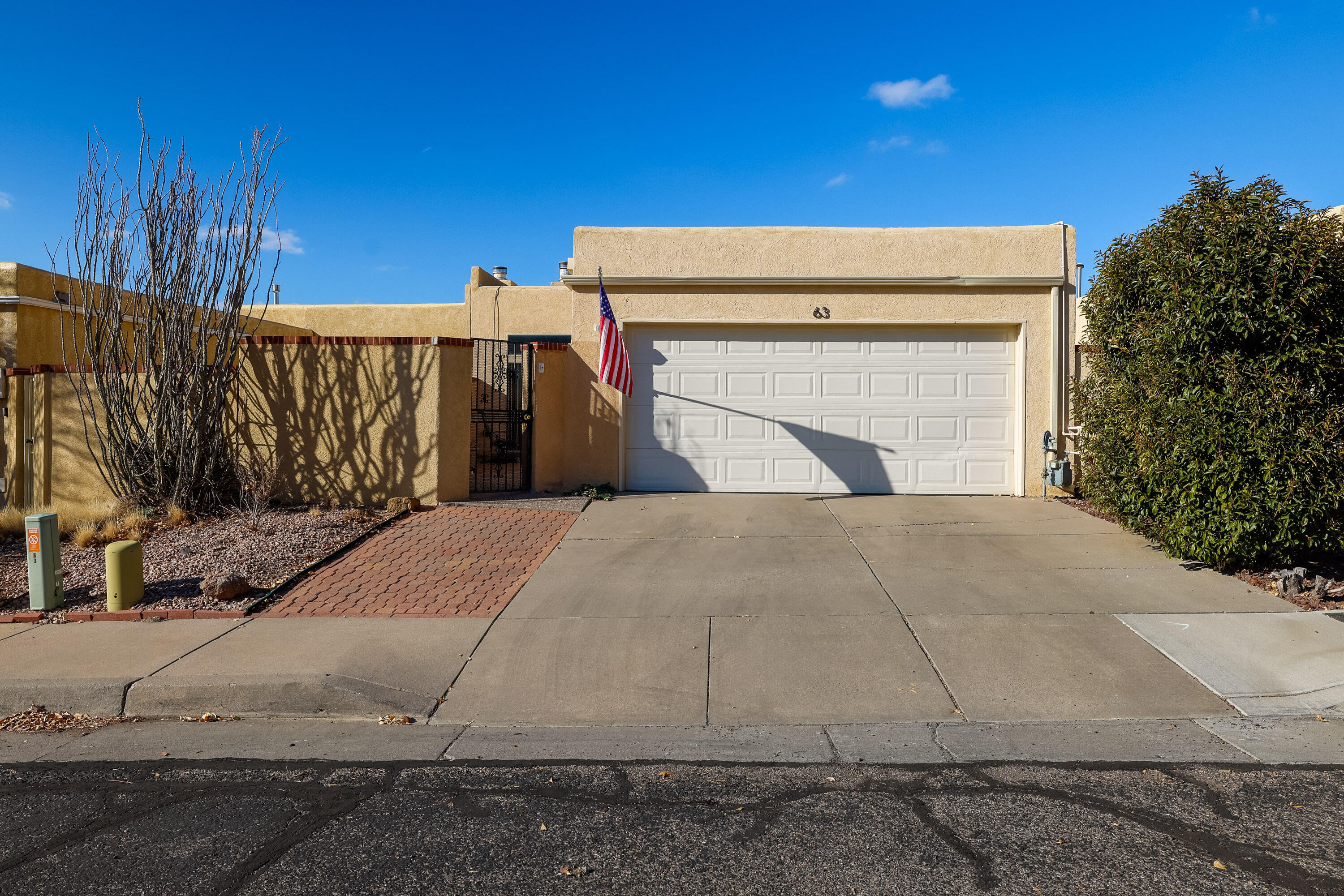 Nestled in the desirable Sandia Foothills, this charming 2-bedroom, 2-bath townhome offers stunning mountain views and thoughtful outdoor spaces. The private, enclosed front courtyard welcomes you, while the finished bricked backyard with planting beds is perfect for gardening or relaxation. Inside, enjoy an updated kitchen with stainless steel appliances, a full bath, and a 3/4 bath for added convenience. With a covered patio and a prime location near trails and amenities, this home is a foothills treasure!