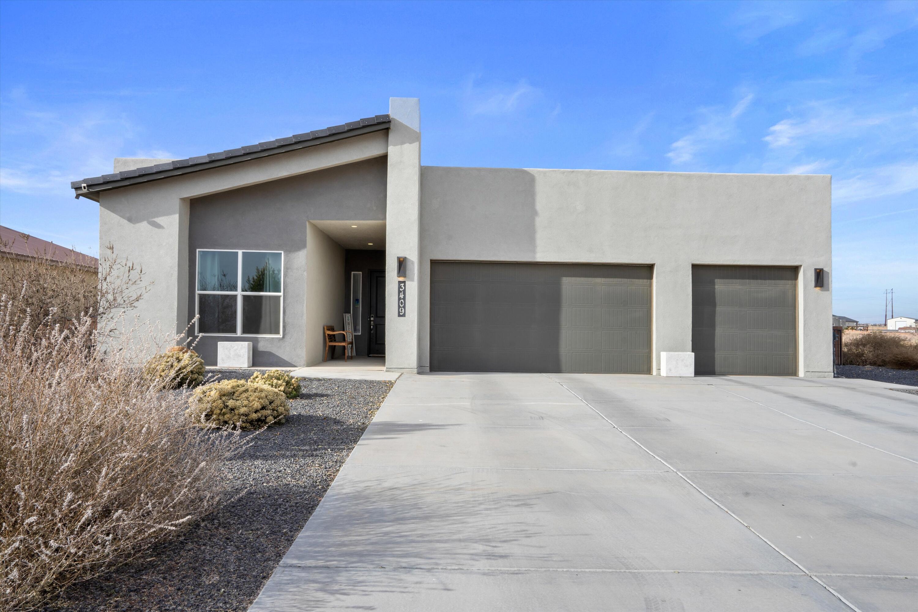 Welcome to your dream home in the sought-after Vista Entrada neighborhood of Rio Rancho. This home offer modern, open concept living, gourmet kitchen with quartz counters and upgraded appliances.  Truly designed for comfort and style.The oversized garage has an epoxy floor, complete with a workbench and cabinets, making it perfect for any DIY enthusiast. The expansive 0.5-acre lot offers a fully enclosed backyard, professionally xeriscaped, and featuring a charming pergola, creating an ideal space for relaxation and entertainment. Don't miss the opportunity to own this exceptional property and experience modern living in a tranquil, picturesque setting.  Schedule a showing today via ShowingTime*Fridge, W/D will convey with competitive offer.