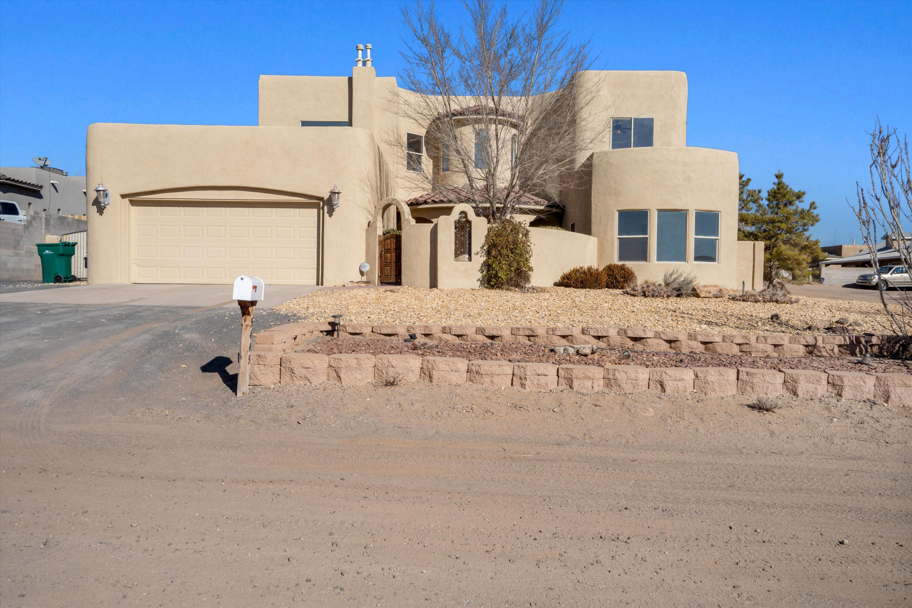 Nestled on an expansive 0.56-acre corner lot, this stunning custom home offers endless possibilities! Featuring 4 spacious bedrooms, a versatile loft, and an incredible layout, this property is perfect for those seeking space and style. The primary suite is located upstairs for ultimate privacy and boasts breathtaking views of the Sandia Mountains. The kitchen is a true showstopper, with granite countertops, stainless steel appliances, elegant cabinetry, and travertine floors that elevate the heart of the home. The exterior is just as impressive, with a beautifully landscaped front yard and a private courtyard entry for added charm. The oversized lot offers side yard access through double gates, ideal for storing RVs, boats, trailers, or other outdoor equipment. Come check it out today!