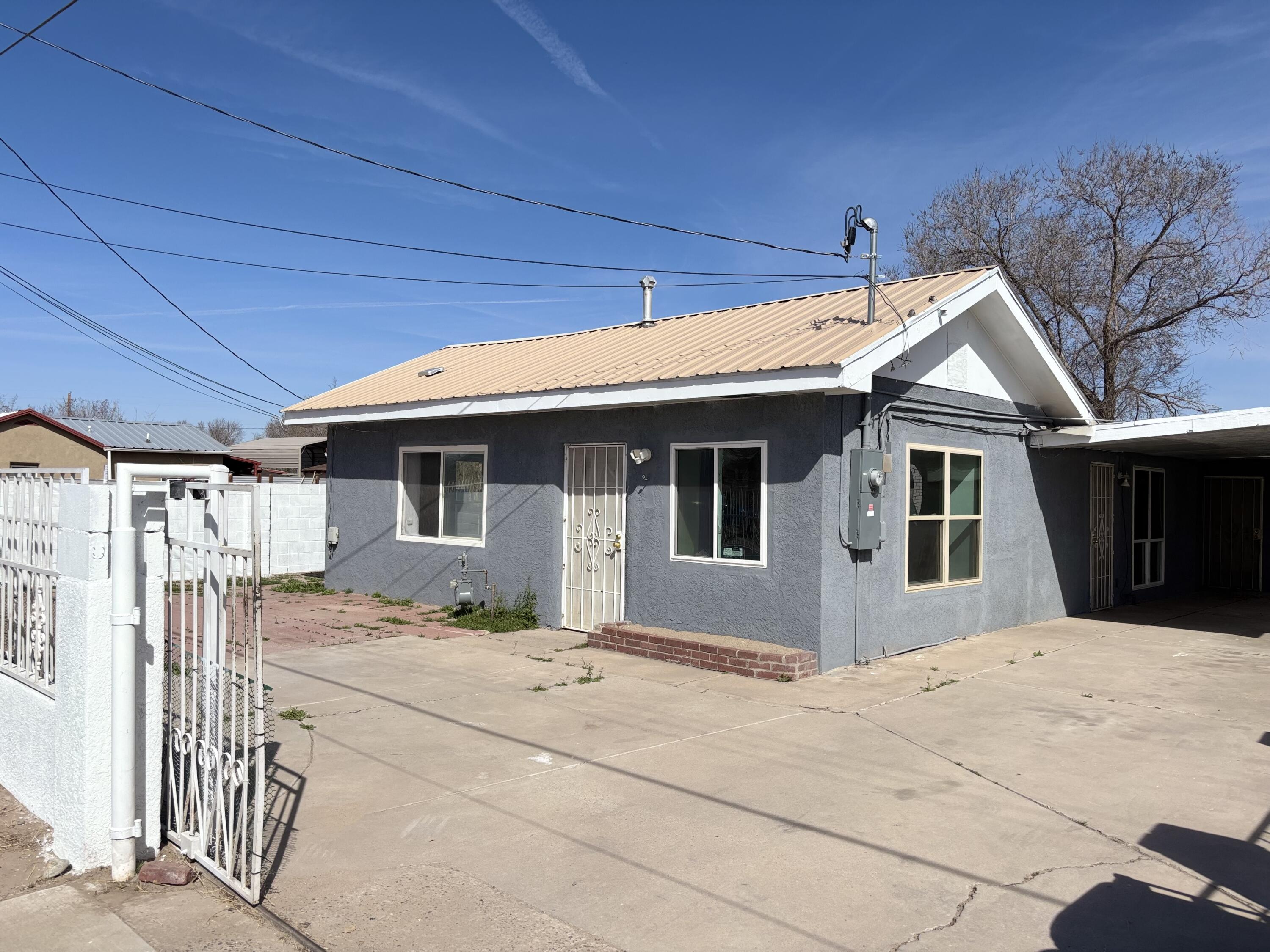 Welcome to this renovated home, offering a unique layout. It features two primary bedrooms, each located on separate sides of the house for added privacy. The central room can serve as a flexible space perfect as an office or a third bedroom. The second primary bedroom even includes a separate entrance. The spacious kitchen adds to the appeal of this diverse and thoughtfully designed home. The home features newly installed, large windows (2024) that flood the space with natural light.The spacious front yard, complete with a porch, is perfect for any season of entertaining. At the back, you'll find a brick oven ideal for those who love to cook outdoors and another inviting space to host parties or enjoy dinner under the stars.  Come see it today!