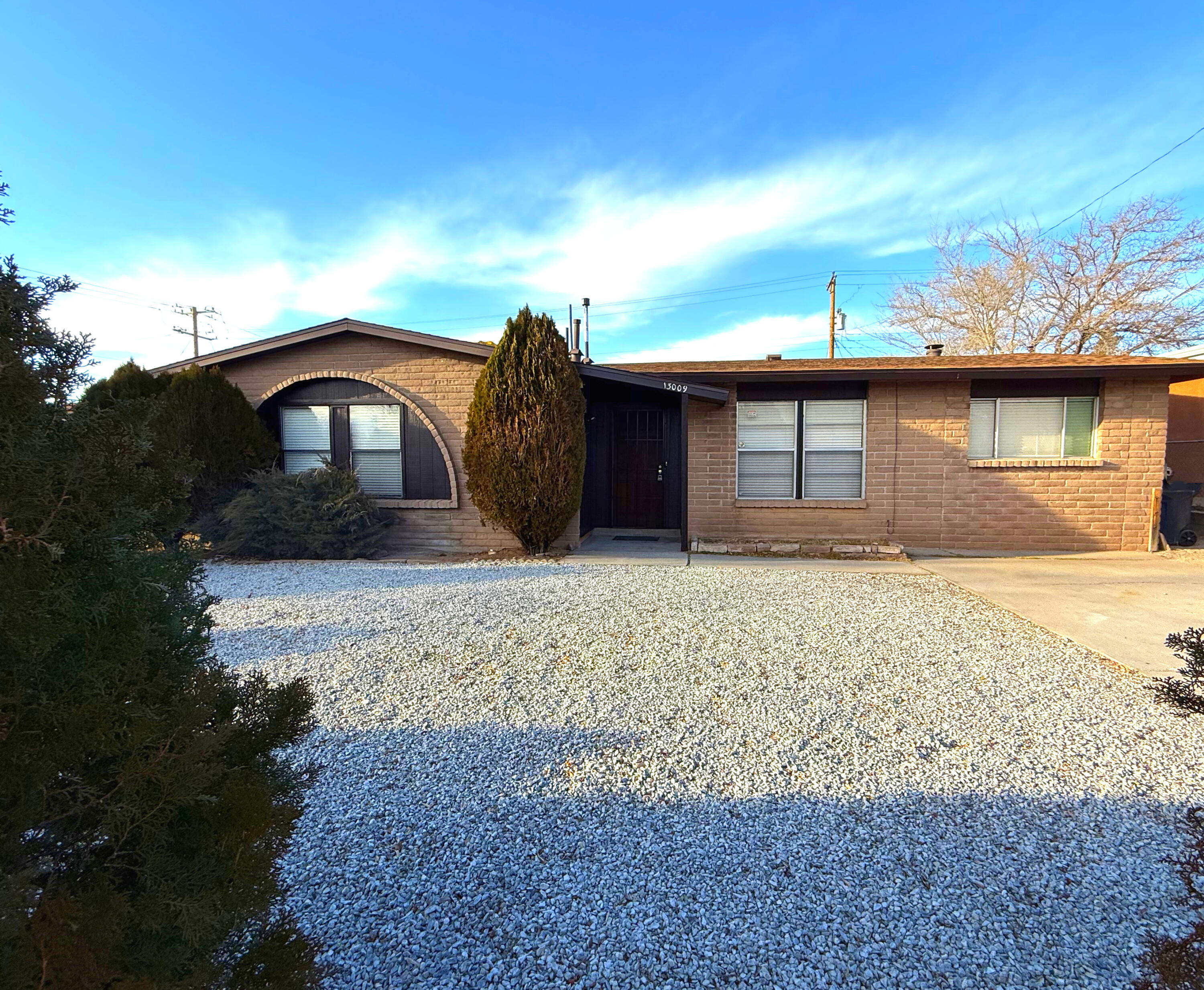 Nestled Away in the NE Heights and 50 yards from a Neighborhood Park, this nicely upgraded house sits on a .14ac Lot and is perfect for Buyers that need to be close to a Freeway, Albuquerque and many amenities for the City. This is a 3 BR, 2 BA, 1400sf home with a lovely Living Room and also a spacious Family Room. The Kitchen is completely upgraded with Custom Cabinets & Quartz Countertops. This Kitchen has all New Appliances and has ample cabinet space. Both Bathrooms have been updated with new Tile, Vanities, Mirrors & Lighting. The Bathtub is newly refinished and the Master Bath includes an LED lighted Medicine Cabinet with Anti- Fogging Technology and an interior receptacle. This house has a beautiful Wood Stove and the Master BR has a Closet Organizer installed. Welcome Home!