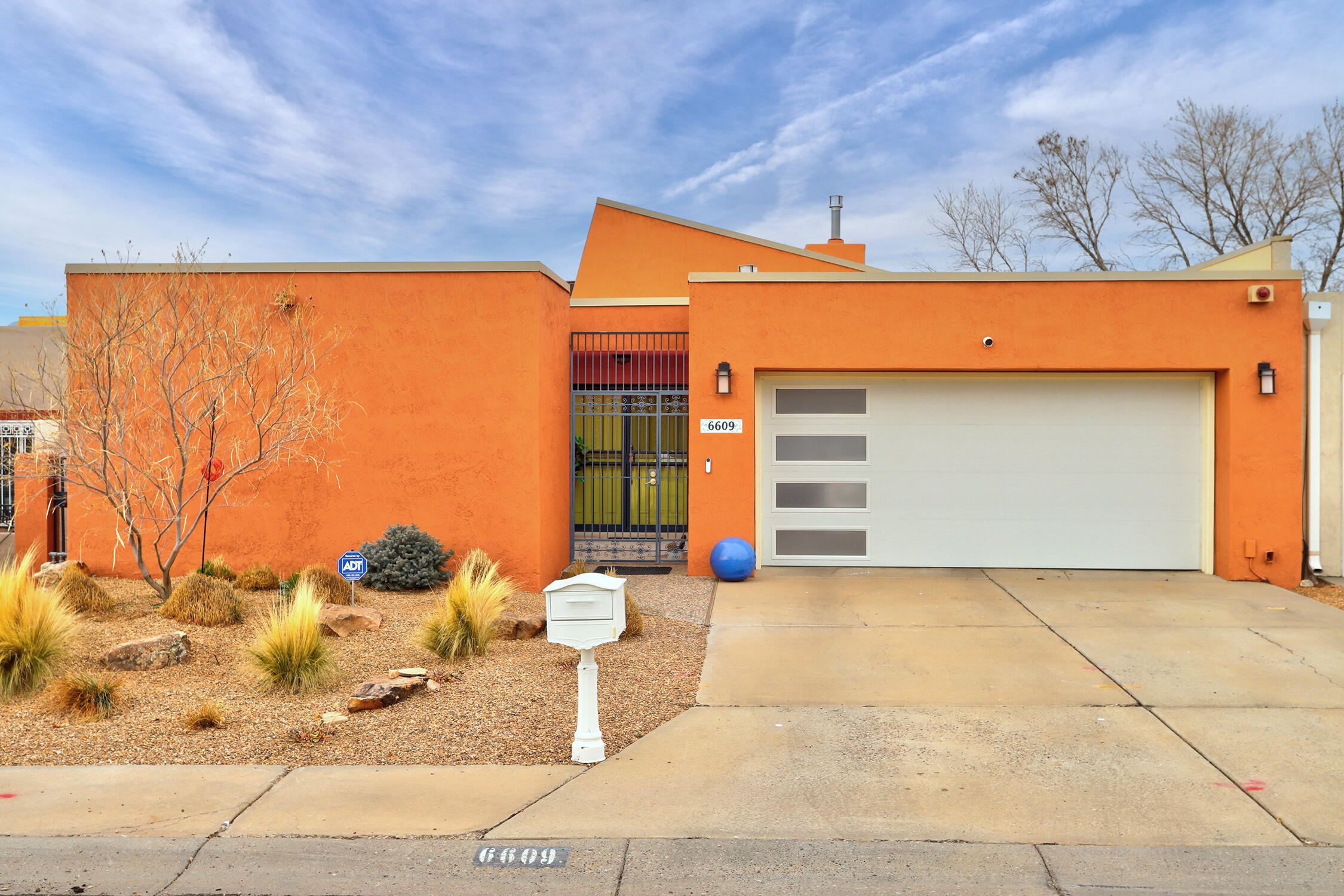 Discover this meticulously updated Mossman Townhome, where timeless mid-century modern design meets contemporary luxury. With only the garage wall adjoining the neighboring property, this home offers privacy and abundant natural light through three sets of patio doors. Every detail has been thoughtfully remodeled to create an inviting, modern retreat.  Living room features vaulted ceilings, a two-way gas fireplace with custom pecan and walnut mantles. Gourmet kitchen includes quartzite countertops, quarter-sawn oak cabinets, terrazzo tile flooring, and high-end appliances.  Enjoy a spa-like retreat in Primary Suite with quartzite countertops, freestanding soaking tub and glass-enclosed shower.  Walk-in closet, LG stacking washer/dryer & laundry station. TPO Roof, Owned Solar.  See more...