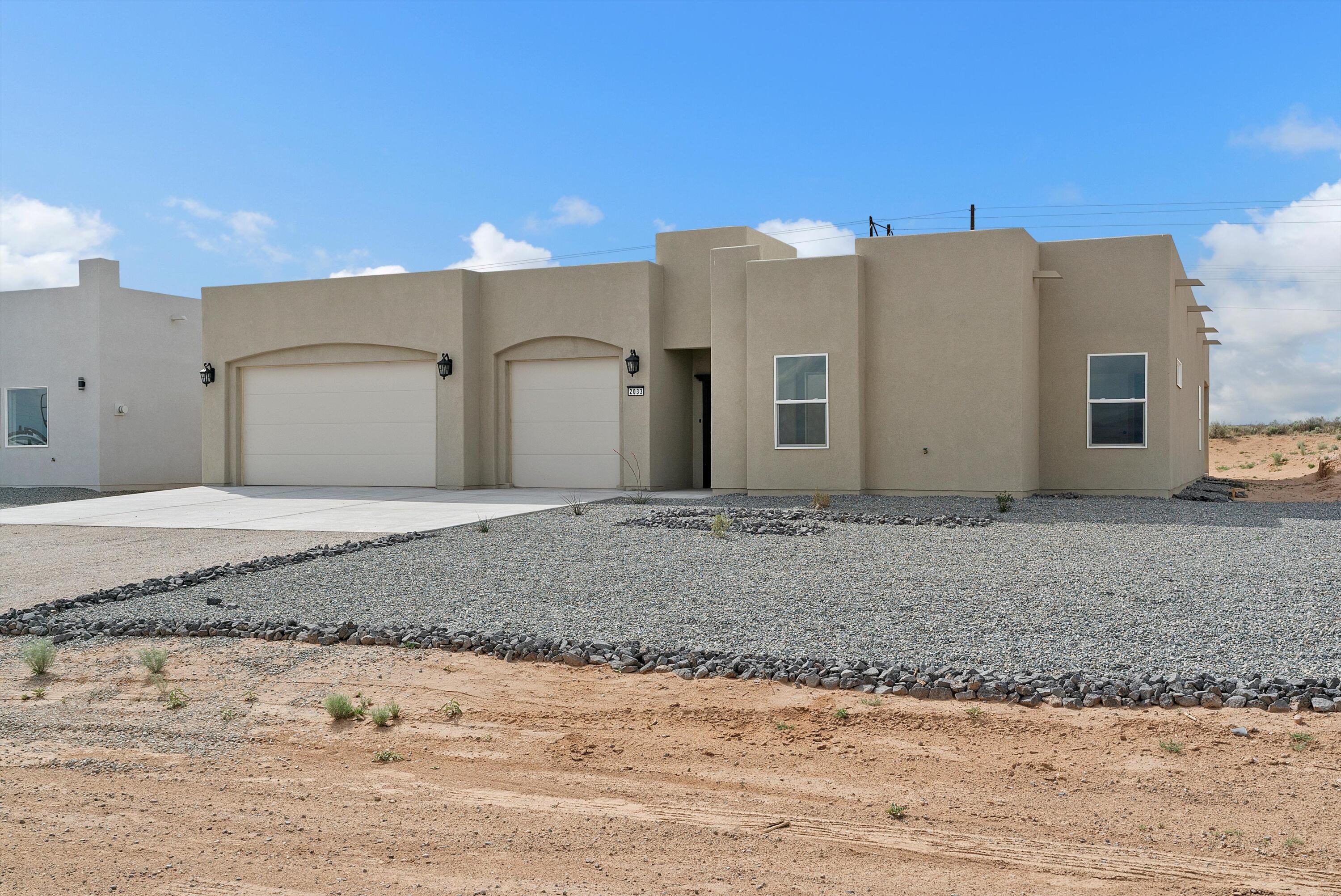 Open House Sunday 12-3 pm, come take a look. Custom home in Rio Rancho , vibrant beauty of the high desert! This newly constructed gem features 4 Br 4 BA 3 CG on 1/2 Acre with 2 master Bedrooms, a chef's kitchen with premium appliances, large kitchen island, walk-in Pantry . Open floor concept perfect for both relaxation & entertaining. Relax hang out in your own private courtyard. Located near Rio Rancho Event Center, UNM Hospital, and Intel, with seamless access to Los Alamos, Santa Fe and Albuquerque. Top-rated schools. Ideal for outdoor lovers, the area offers endless adventures, including walking, bike and ATV trails. New Block wall in back yard. Move in ready!