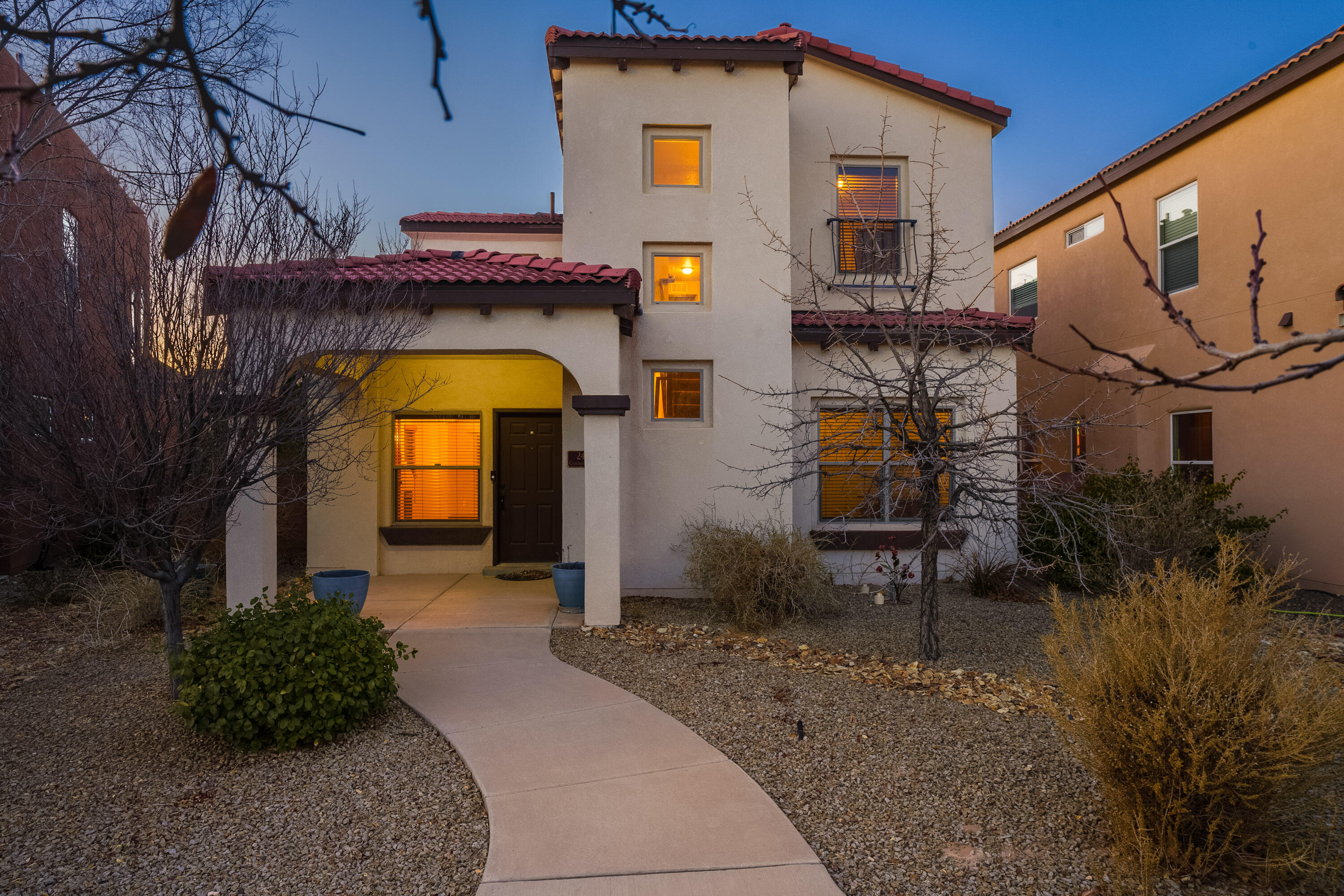 Discover this charming 4-BDRM Raylee home located in the vibrant Mesa Del Sol community. With custom details throughout, this home features elegant archways, a pitched tile roof, and warm tones that create a welcoming atmosphere. The spacious kitchen boasts a large island, SS appliances, tile backsplash, a pantry, and bonus wine cooler/coffee bar--perfect for entertaining. Tile floors through the main living area, where a flexible bedroom/office sits next to a guest bath. Upstairs features 3 additional bedrooms, the primary suite as well as a second with direct access to a bathroom. Home features a tankless WH and refrigerated A/C. Outside has a covered back patio, mature fig tree and landscaped yard. Mesa Del Sol offers community parks, pool, dog parks and more...