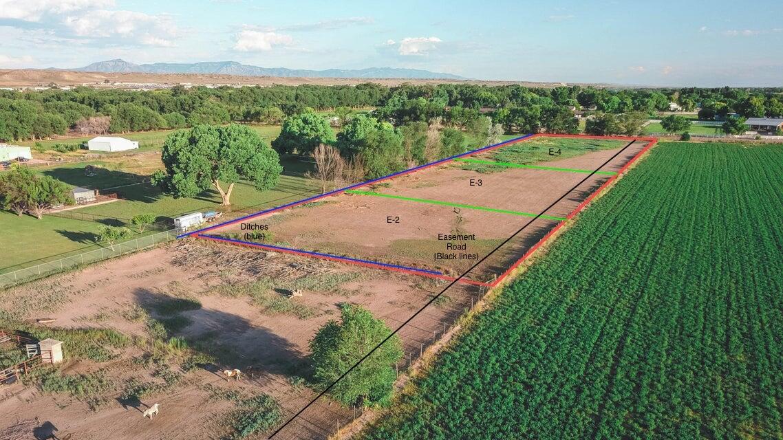 Back 1 acre lot PENDING. Front 2 still available!Appraised (all 3) at $503,000 in 2023! $167,000/parcel, or packaged 2 at $317,000 for instant equity.This exceptional property offers a blend of natural beauty, versatility, oasis or investment potential. Surrounded by lush cottonwood trees and neighboring a sprawling 60-acre alfalfa field, just steps away from scenic walking trails, horse properties, and the Rio Grande, this location is ideal for outdoor enthusiasts and those seeking tranquility.  Previously laser-leveled for optimal use, the property features ditch access to all 3 acres, with main ditch access available from the back parcel. Fully fenced and subdivided into three individual one-acre lots, it offers endless possibilities, whether you're looking to farm or bui