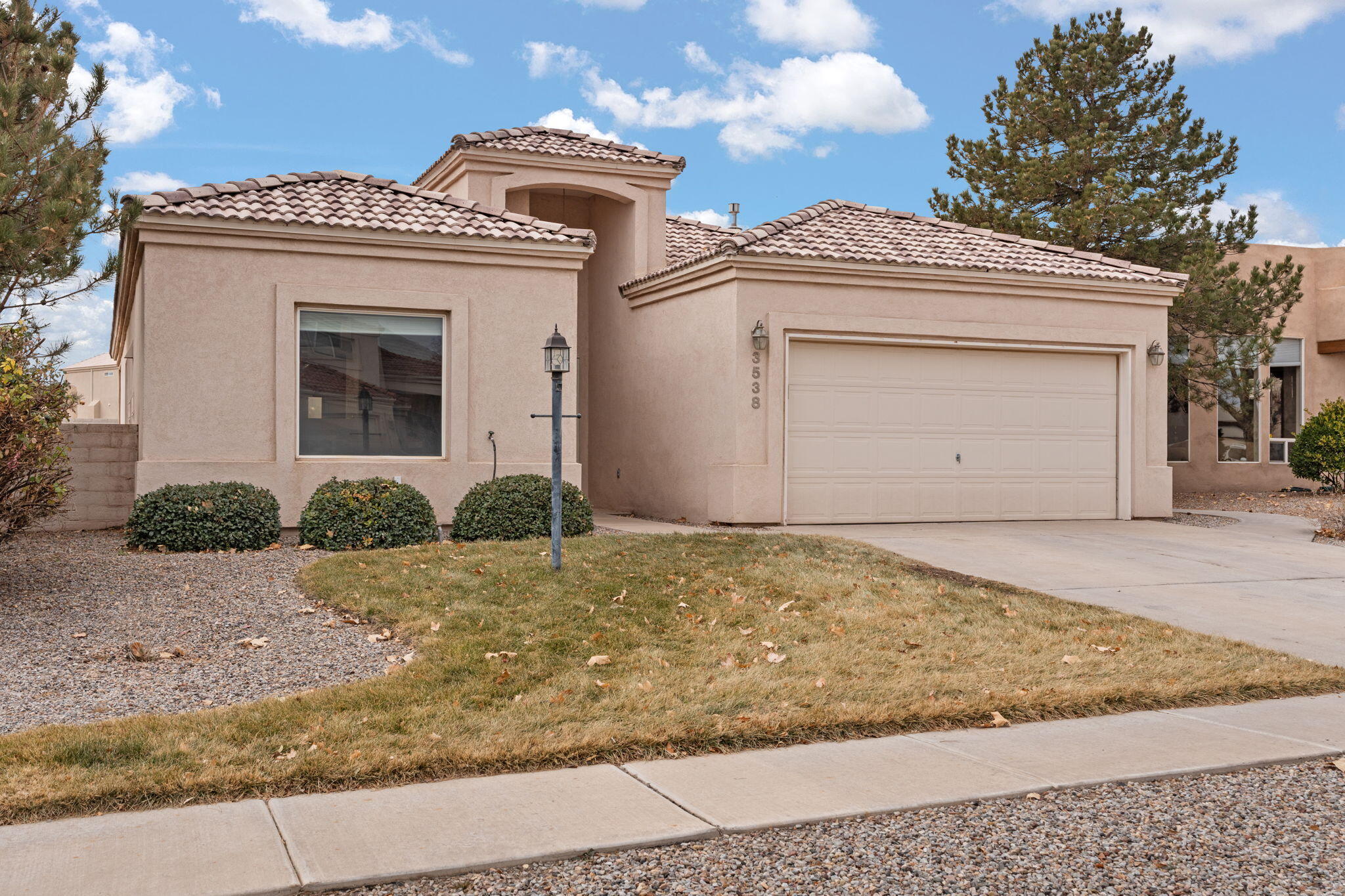 Welcome to your new home! This 3 bedroom 2 bathroom single story house is conveniently located in central Rio Rancho.  You'll love the fresh, updated kitchen with quartz countertops, stainless  appliances, breakfast nook and movable island!  The formal dining area is located in the large great room which boasts a fireplace and built-in entertainment/shelving area.  No carpet here, there is engineered hardwood and tile throughout!  Recently updated secondary bathroom and separate shower/soaking tub in the primary bathroom.  Easy care landscaping in front and back as well as a large storage shed!  Located in a top rated school district!  This is the move-in ready home you've been waiting for!