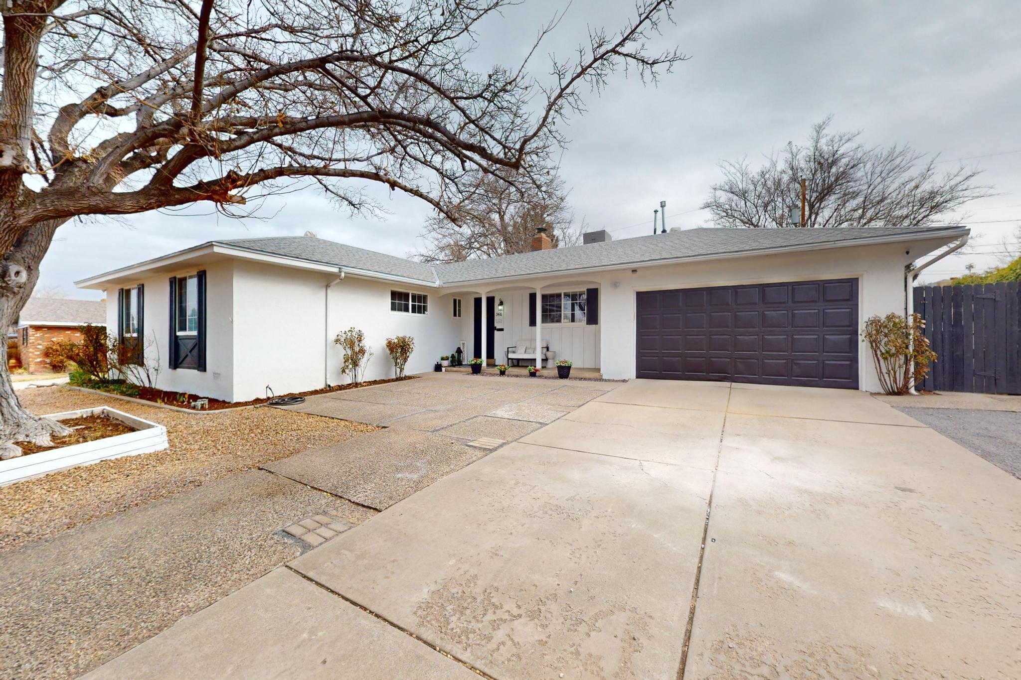 Welcome home to the Stardust Skies neighborhood. This impressive move-in ready Mossman home has an abundance of natural light, luxurious upgrades and two + living spaces for the whole family + a new roof! This fabulous Northeast Heights remodeled single-story Mossman home features 3 bedrooms, 2 bathrooms and a 2-car garage with 2,624SF on a cul-de-sac street. Stunning gourmet kitchen with upgraded appliances, modern lighting, soft close drawers & cabinetry, quartz countertops, open shelving and white tile backsplash.  Spacious owner's suite is separate which provides peace and tranquility. Remodeled 3/4 primary bathroom has upgraded walk-in shower and dual sink vanity and modern finishes. Sun room could be home gym, flex space, office, storage and much much more! MORE---->>>>>