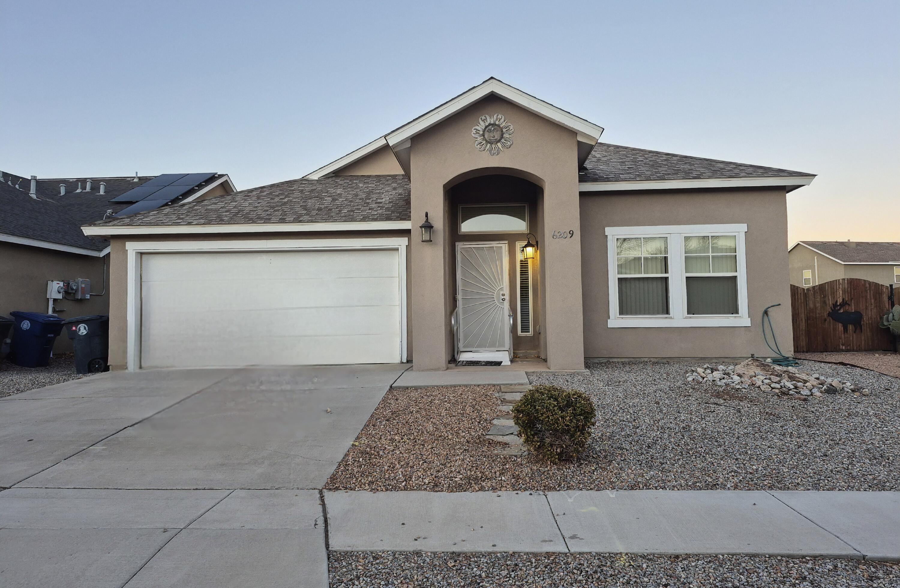 Beautiful, clean, well kept 3 bedroom, 2 bath house with an open floor plan in the kitchen to main living area.  Elevated ceilings, nicho, covered back porch has a great view of the Sandia Mountains.  Nice corner lot with backyard access through a custom gate. Gourmet Kitchen w/ island & stainless steel appliances. A formal living & dining areas in front of home. Master bath has a relaxing jetted tub. Not available for showings until Monday January 20.