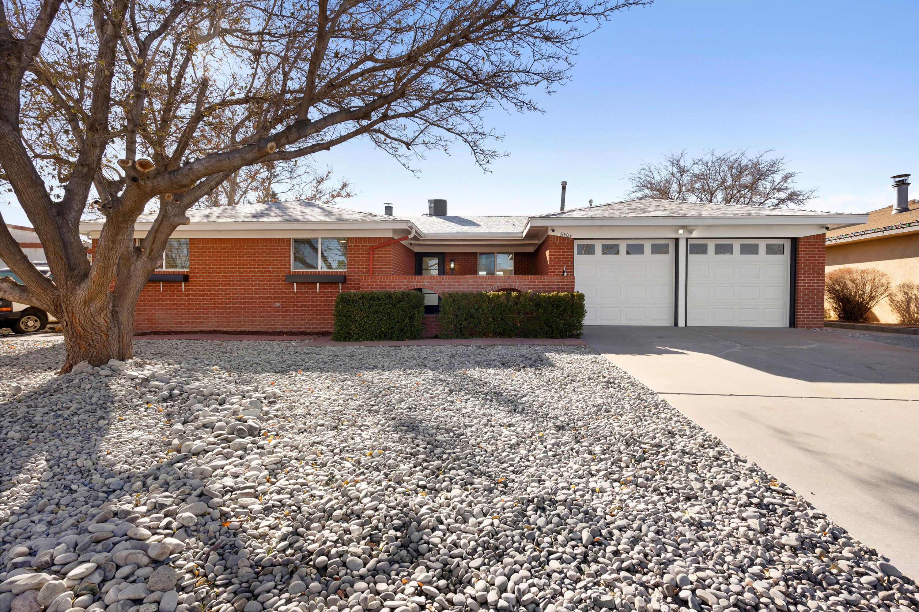 EVERYTHING YOU'VE BEEN LOOKING FOR IN A BEAUTIFULLY REMODELED HOME IS RIGHT HERE! This 4-bedroom, 2-bath, 1,975 sqft sanctuary blends modern elegance with timeless comfort. From the sleek black-paneled glass front door to the fully updated kitchen with custom soft-close cabinets and top-tier appliances, every inch of this single-story home has been revitalized. Imagine entertaining in the bright, open living spaces with recessed LED lighting, or relaxing by the newly renovated pool complete with  diving board and covered patio. Located in a tranquil, established neighborhood near parks and schools, this home is ready for you to move-in! Don't miss your chance to make this stunning retreat yours--schedule a tour today!