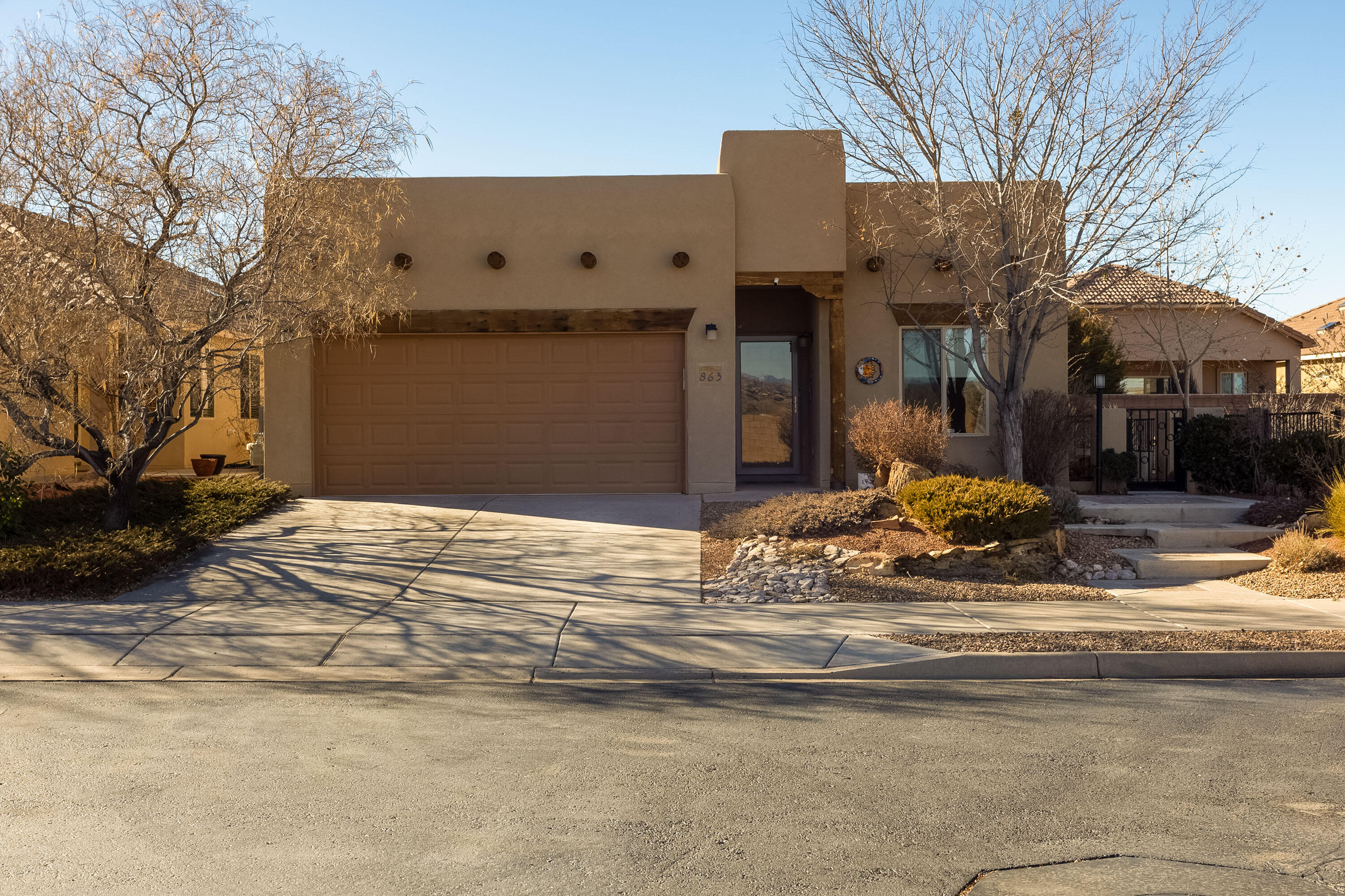 This is the one you've been waiting for! Two bedroom plus office! You will love the spectacular Sandia views from this original owner home. The well planned landscaping is low maintenance and features both a covered and open patio, water feature and fire pit with plenty of room for gardening, bird watching and entertaining. Numerous flowering plants and bushes create a garden sanctuary. Open floor plan flows nicely with living room featuring a gas fireplace, dining room and spacious chef's kitchen with gorgeous cabinetry, granite counter tops, island and stainless appliances. Primary Bedroom is a perfect size and features separate walk in closets and a sizable bathroom with jetted tub, separate shower and double sinks. The many amenities Del Webb 55+ communities are known for including