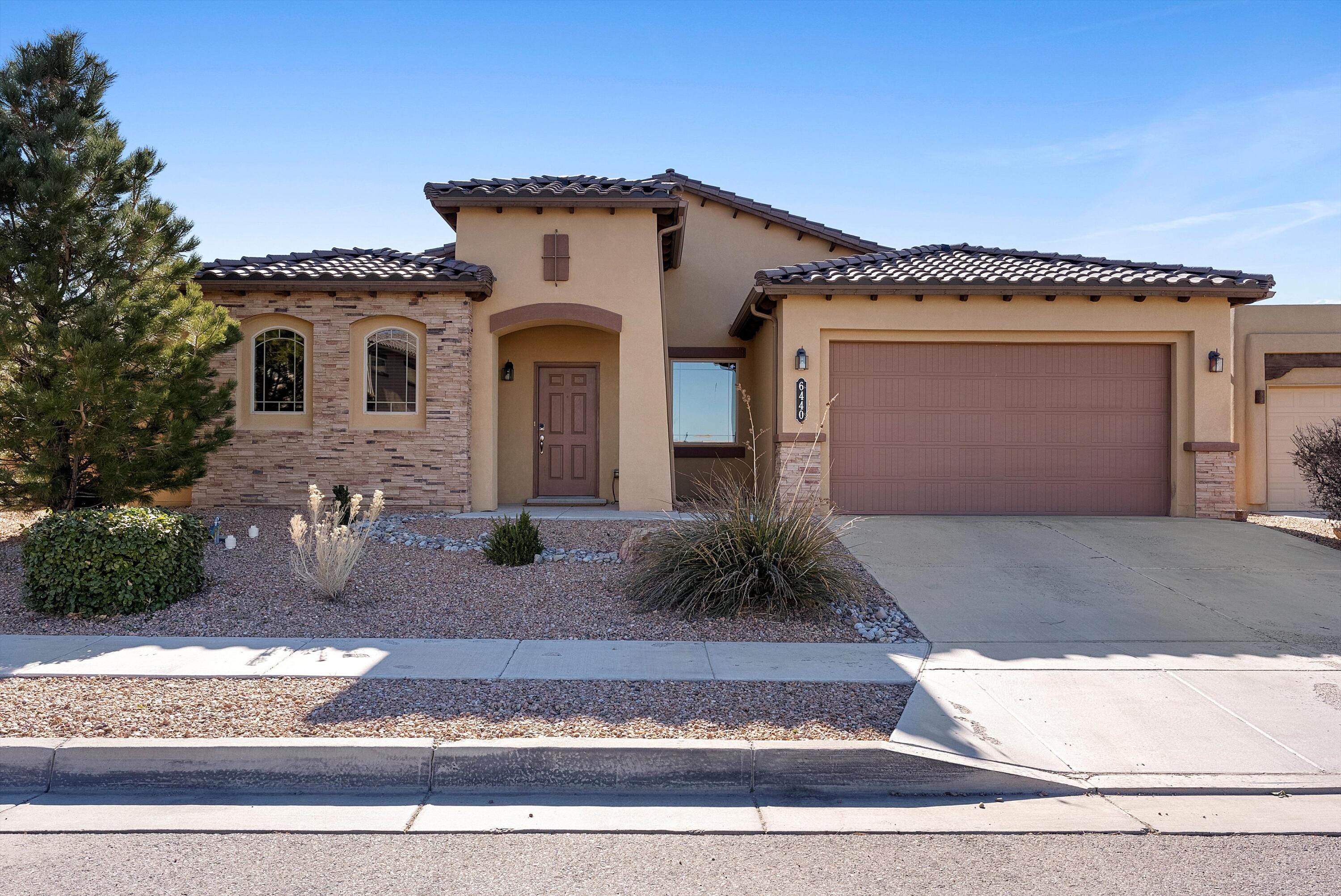 Welcome to your dream home in the desirable La Cuentista subdivision of Northwest Albuquerque! This stunning 4-5 bedroom, 3 bath residence, built in 2012, combines modern elegance with comfort and functionality.As you enter, you'll be greeted by a bright and airy open floor plan that seamlessly connects the living, dining, and kitchen areas. The spacious living room features a cozy fireplace, perfect for relaxing evenings with family and friends. Large windows throughout the home provide breathtaking views of the surrounding landscape, allowing natural light to fill the space.The gourmet kitchen is a chef's delight, equipped with newer appliances, ample counter space, and a generous pantry. Adjacent to the kitchen, the dining area offers the perfect setting for entertaining