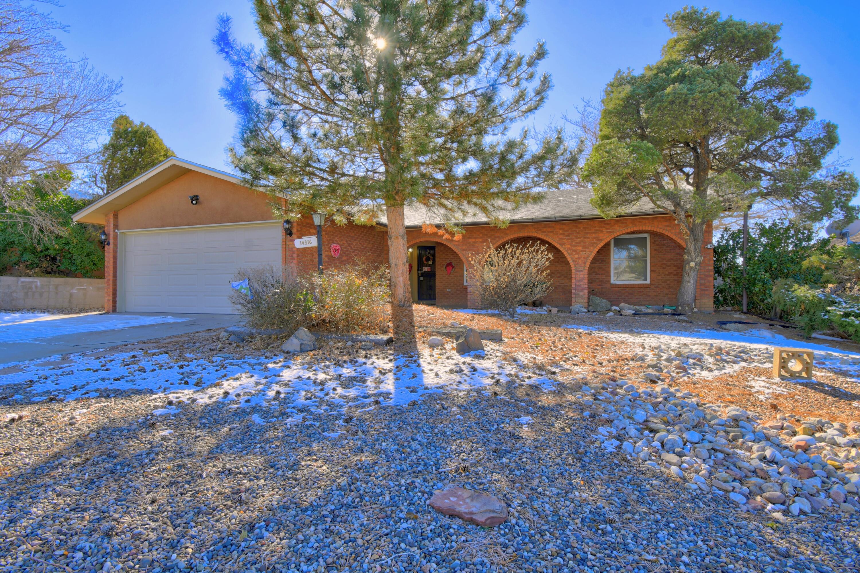 Open house Sunday 1/19 1pm-3pm. FOOTHILLS! Nestled at the base of the Foothills close to hiking and biking. This light and bright single level 3 bed/2 bath home offers an open floorplan with completely remodeled kitchen. Corian countertops, large pantry and recessed lighting with large breakfast bar that opens to large great room. Beautiful backyard and excellent views of the Sandias. Easy access to 1-40, Sandia Labs, Kirtland Air Force Base. Nice home!