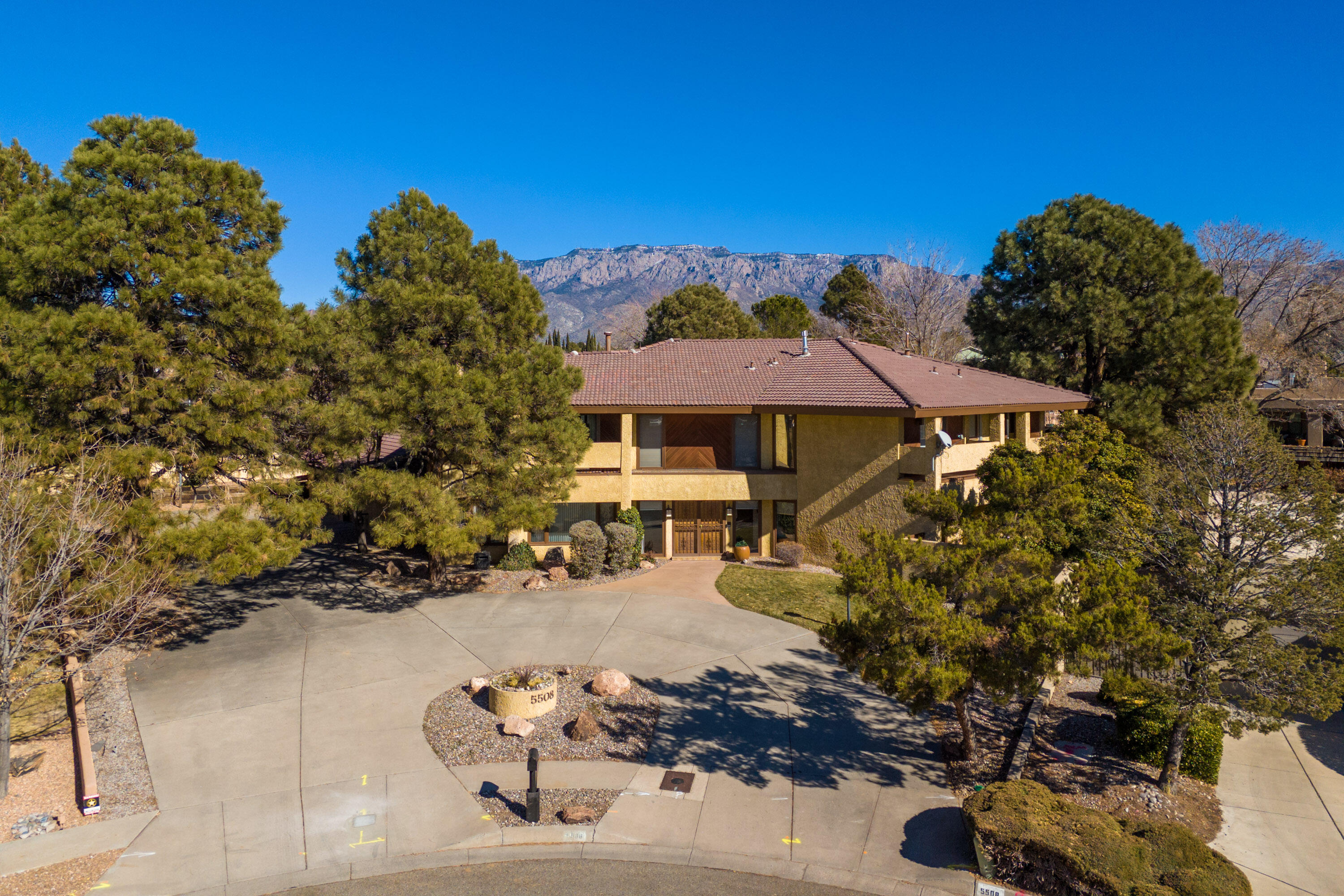 Beautiful cul-de-sac setting for this stately home on an enormous neighborhood lot. Swim in the pool, lounge on the patio, or dine in the fabulous cabana w/ wood burning fireplace. Gorgeous carved wood doors greet you as you enter this light filled home.  Magnificent great room-lofty ceiling showcasing the artistic fireplace. Endless entertaining opportunities with full wet bar and open concept floorplan. Well-appointed kitchen featuring attractive custom flat front cabinets, solid surface counters, cozy breakfast nook, upgraded appliances, & large island with bar seating. Lower lever has a formal dining-Coffard ceiling, half bathroom, & is completed with possible in-law suite with full bath, bedroom and flex room (office space). Spacious primary suite with balcony, gas fireplace and...