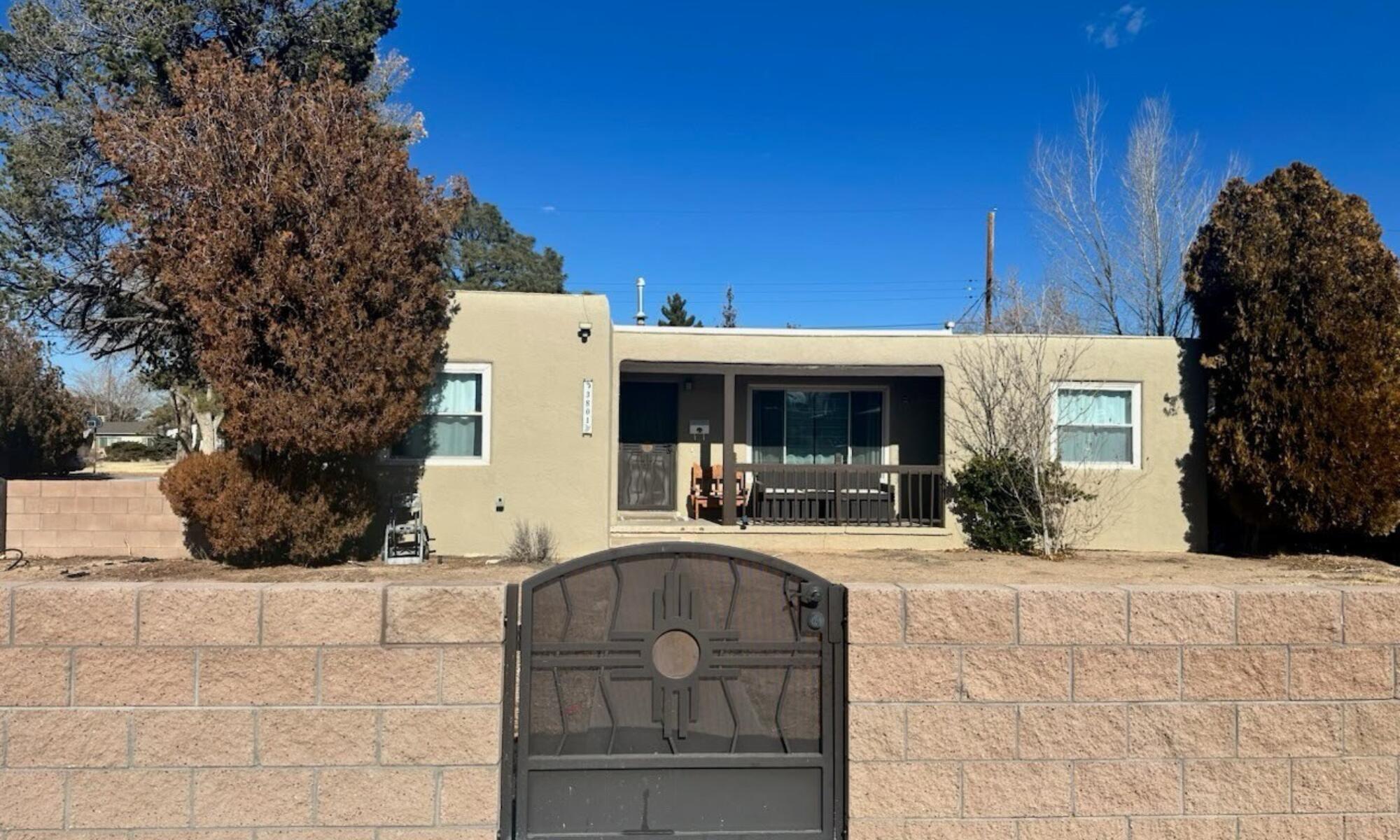 Welcome to this beautifully updated 4-bedroom, 2-bathroom home located in Albuquerque's South East Heights, in the historic Ridgecrest residential neighborhood conveniently close to Nob Hill, University of New Mexico to the North, and Kirtland Air Force Base to the South.This home features two spacious living areas, with updated flooring, newer windows, and stylish light fixtures. The kitchen is a chef's dream with dark cabinets, sleek quartz countertops, and stainless steel appliances. The primary bathroom is a retreat with a stunning standalone tub. Enjoy privacy and security with a gated block wall and metal gates. Conveniently located near shopping, dining, and entertainment, this home offers comfort and modern elegance. Schedule your showing today!