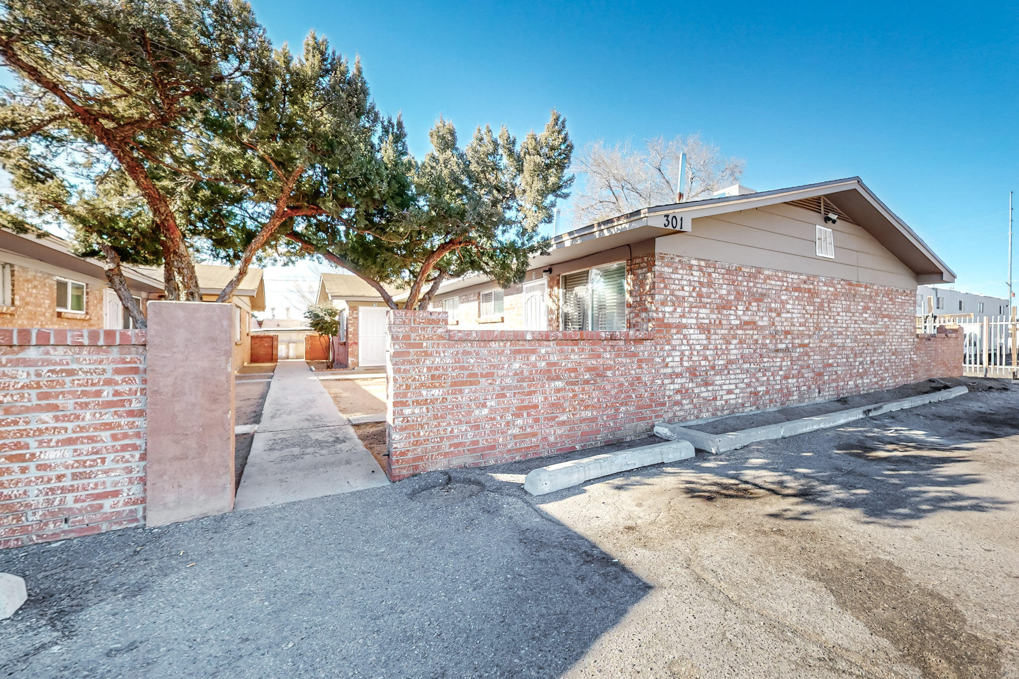 Affordable Housing - 100% Occupied & Cash FlowWelcome to this well-maintained, fully occupied tri-plex located in the heart of Albuquerque. This affordable housing property offers a fantastic investment opportunity with positive cash flow for the current owners. The property consists of:2 Units: 1 Bedroom, 1 Bath1 Unit: 2 Bedrooms, 1 BathEach unit is updated and maintained in good condition, offering clean & comfortable living spaces for tenants. Recent improvements include:Newer Coolers: Installed within the last 2 seasons for reliable coolingRoof: re-shingled in 2024The property is clean and well-kept, providing a hassle-free investment. Next Door Opportunity: The tri-plex at 305 Tennessee St is also available & not currently listed.NO Creative Finance.