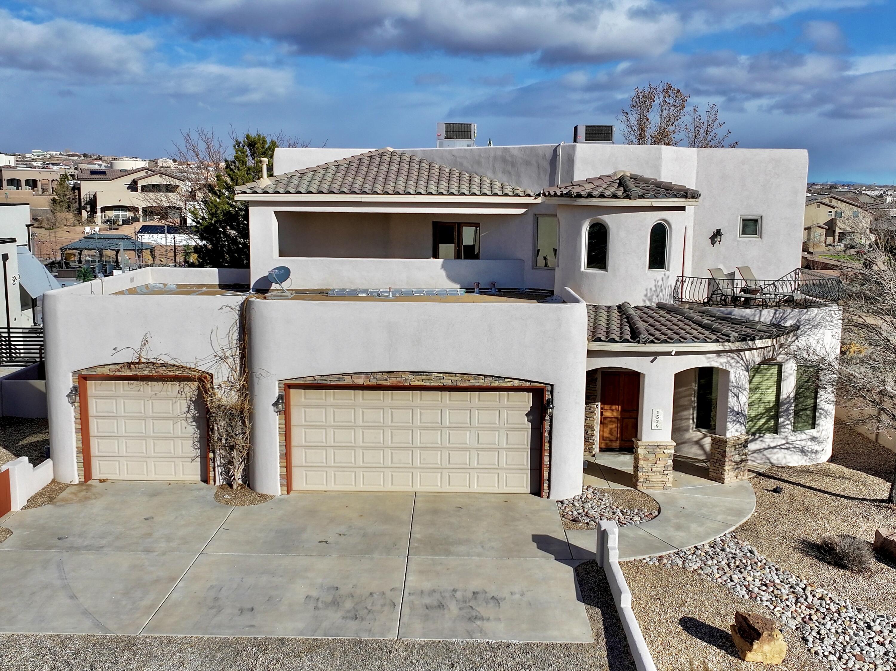 Welcome to this stunning custom home in Vista Montebella! Situated on a spacious half-acre lot with this home offers exceptional indoor/outdoor living. Enjoy breathtaking mountain views from multiple balconies and a versatile floor plan. The chef's kitchen boasts granite counters, cherry cabinetry, and stainless appliances. A gas kiva fireplace anchors the inviting family room. The first-floor master suite features a spa-like bath with a jetted tub, steam shower, and huge walk-in closet. A guest bedroom with an adjacent full bath is also on the main level. Upstairs, a loft with a wet bar is perfect for entertaining. This home features a top-tier solar system that fully covers its electrical needs, ensuring energy efficiency, lower utility costs, and sustainable living!