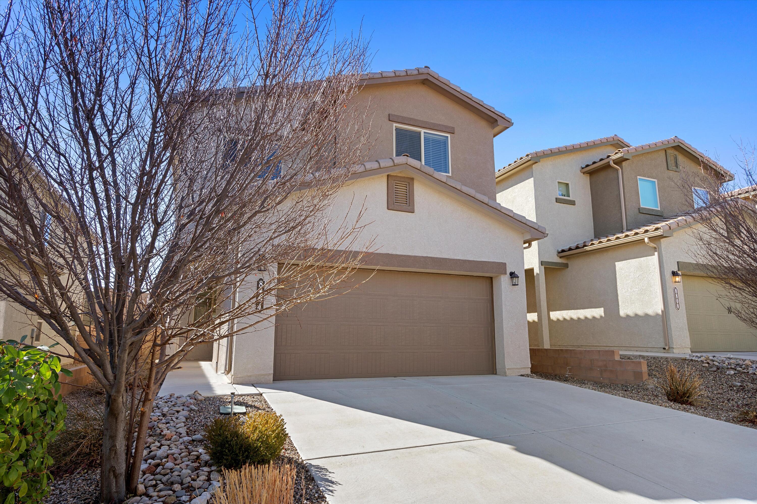 This beautiful two-story 2,230 sq ft home offers a spacious open layout. Situated in the highly desirable Tierra Oeste neighborhood, within close proximity to a kids splash pad and dog park, and easy access to I-40. This 8-year-old home also features a large kitchen with granite countertops and a huge central island for all your prep and entertaining needs. A large open living area on the first floor is complemented by a flex loft upstairs that can be a family room or office and provides a comfortable living space with plenty of natural light. It also could easily be converted into a 4th bedroom if desired. The home also boasts newly upgraded light fixtures with ceiling fans accenting its functionality and style, and has a separate master suite with a dual sink vanity & walk-in-closets.