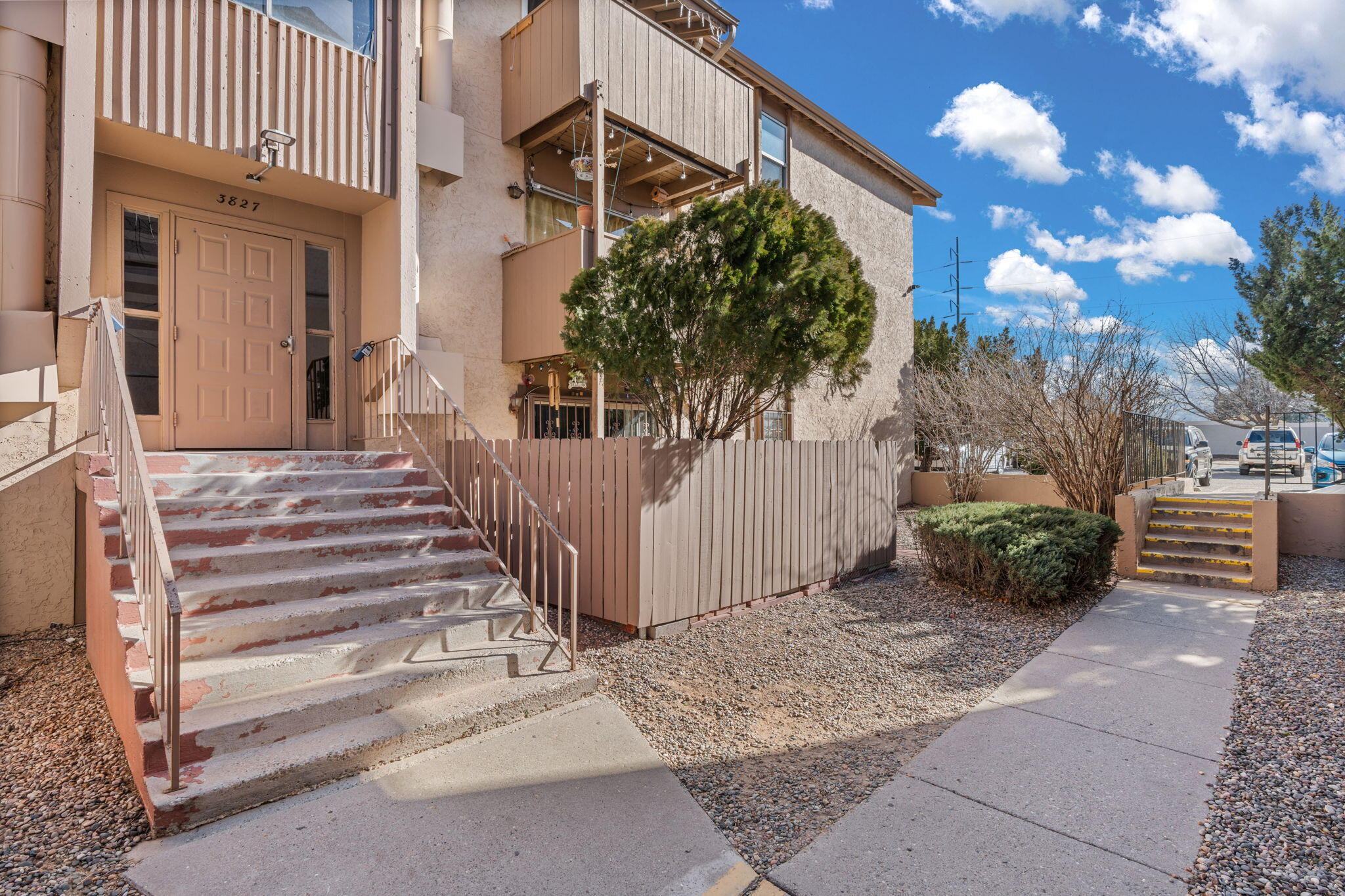 Spacious 3-bedroom, 2-bath condo in the highly sought-after Hillcrest community! This beautiful unit features Silestone countertops and wood laminate flooring in the kitchen and dining areas. The cozy great room boasts a wood-burning fireplace, and the private balcony offers a serene space to unwind. Washer, dryer, and fridge are included for added convenience. Located on the upper level of a secure complex with a guardhouse for peace of mind, this unit combines functionality and charm. New kitchen flooring, new backsplash in kitchen, and new stove all installed March 2025.Enjoy fantastic community amenities, including a sparkling pool, exercise room, clubhouse, and a playground. The HOA covers all utilities except electricity--making it easy to move in and enjoy. Don't miss your chance