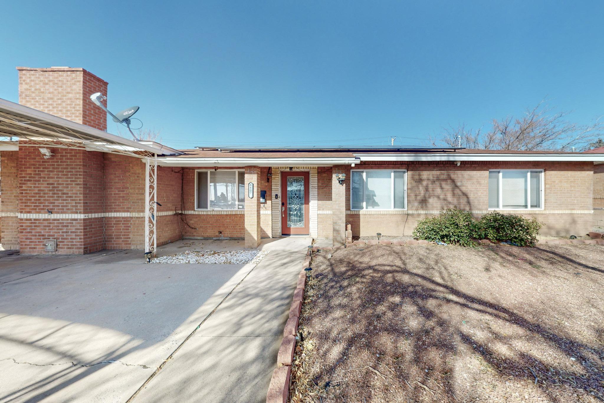 Get a slice of paradise at the corner of main and main!This unique and versatile home is located at the NE corner of Menaul and Wyoming, but on a side street with little traffic. The kitchen has been remodeled and opens to the living and dining spaces as well as a separate den with a big stone fireplace. It is the perfect floor plan for the family to hang out together or for entertaining. The oversized yard has the added bonus of an in-ground pool where you can relax and enjoy peace and quiet right in a convenient part of town where dining, shopping and amenities are all around you.       As if this weren't enough, the house also has an attached efficiency apartment perfect for multi-generational living or for a tenant.