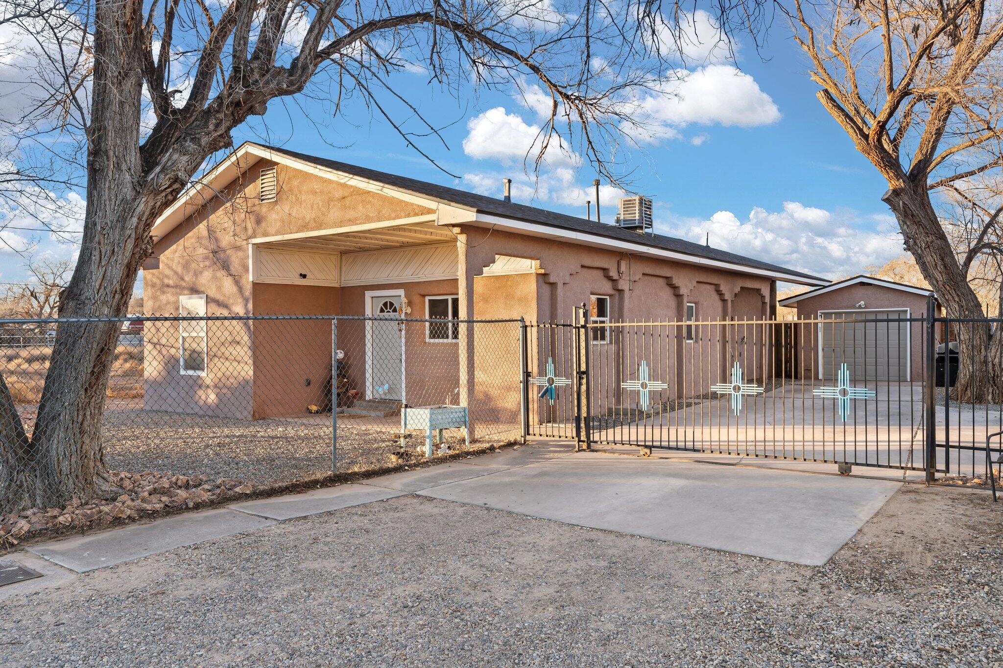 Cozy up in this beautiful home in the south valley. Updated features include Paid off Solar for low to zero electric bills, newer roof with intact warranty, newer refrigerated air and hvac conversion, newer water heater, newer refrigerator. Additional benefits include the corner lot location and the fenced in yard all the way around the home.