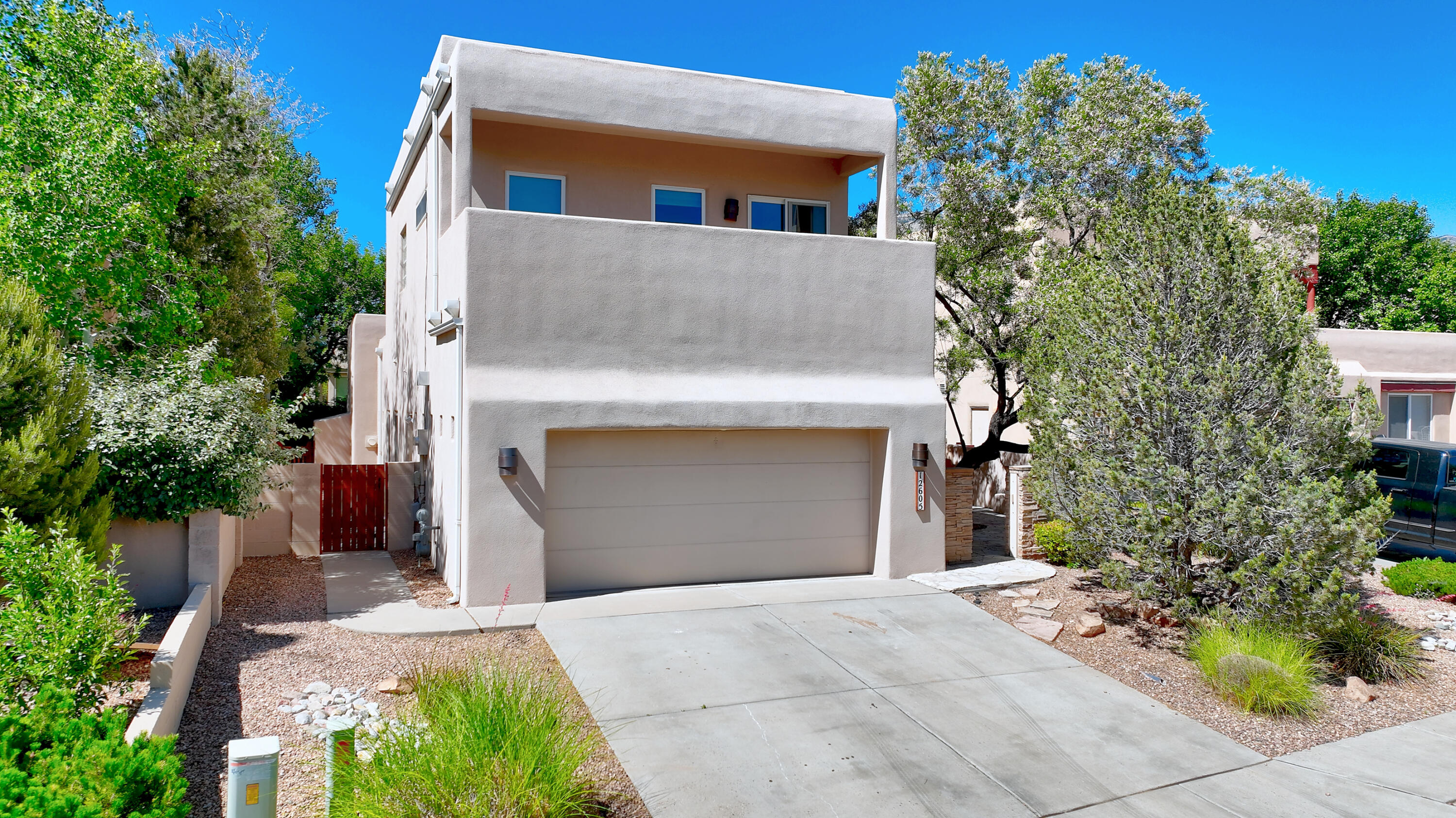 Foothills  /High Desert /Chamisa Trail  custom on L/S cul de sac lot .* 3 BR & study /loft **Sep  PBR with luxury bath ,walk in closet & view deck. Private  entertainers front courtyard with patio, bancos, mountain views-perfect for entertaining. Private back yard with patio & water fall. Inviting foyer. Open, light & bright floorplan with lots of windows & decorator color tones. Expansive great room with raised ceiling , custom fireplace, open to dining areas & kitchen . Formal dining room  raised ceiling & santa fe wall -open to great room & kitchen. Large master chef kitchen with lots of granite counters & custom cabinets, SS appliances , pantry, breakfast bar & breakfast nook- all open to  patio. 2 main floor guest BRS with ample closet space & easy bath access. Xtra long 2 car garage