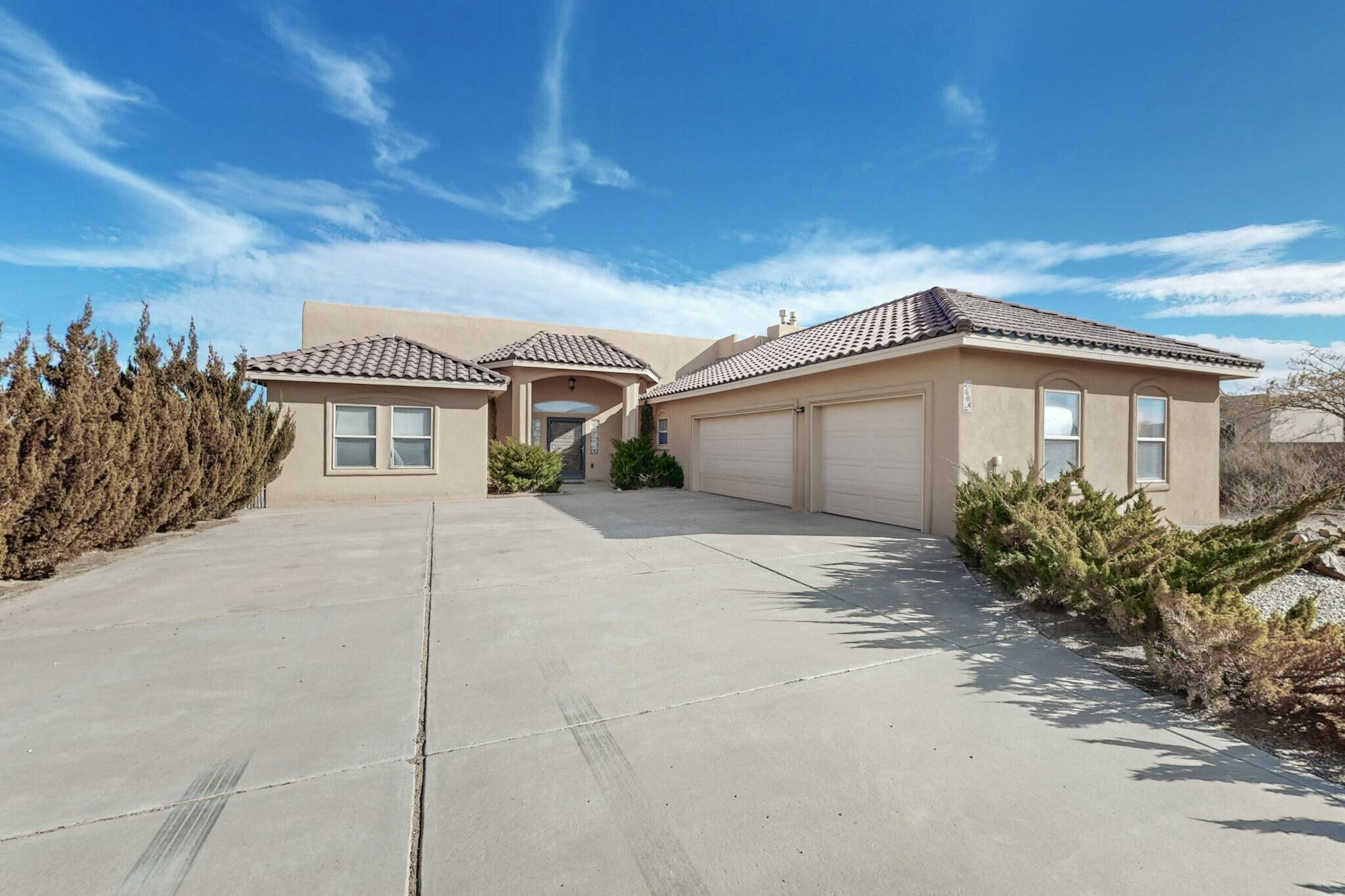 This beautiful custom built home in Northern Rio Rancho is truly a must see. With so many amenities and additions this home the only way to describe it is to come see it in person. It features a sunken hot tub with its very own room, recess lighting, skylights and nichos throughout the house, step in pantry, custom oversized front door, plenty of storage space, salt free water softener, central vacuum system, owned solar, refrigerated air, Saltillo tile flooring throughout, plus many, many more. Schedule a showing and come see for yourself!!!