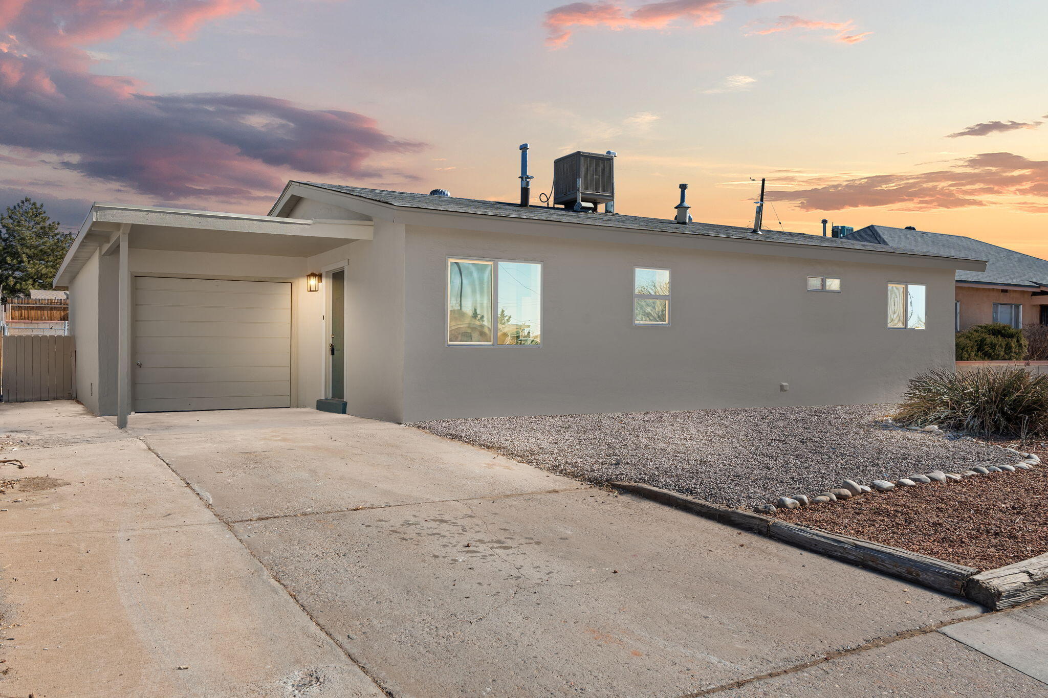 This beautifully updated 3-bedroom, 1-bath home offers the perfect combination of modern style and functionality. Every detail has been thoughtfully updated, from the new stainless steel appliances to the completely remodeled bathroom and brand-new laminate flooring throughout. The interior is fresh and inviting, with a clean white palette, new windows, and fresh paint inside and out, creating a bright and airy atmosphere. The spacious, walled backyard features a covered back patio and a fenced kennel area, ideal for pets or extra storage. With great curb appeal and a 1-car garage, this move-in-ready home is ready to welcome you. Don't miss out on the opportunity to make this house your home!