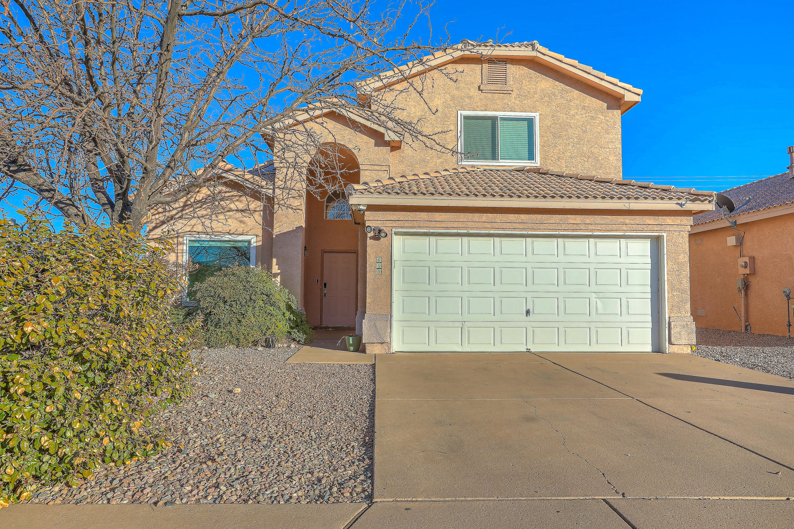 Nestled in a gated neighborhood on a corner lot, this beautifully renovated home offers a serene living environment perfect any buyer. The expansive layout with the primary bedroom on the main floor & guest bedrooms and loft upstairs, is drenched in natural light, providing ample space for design creativity & perfect for indoor plants. With captivating views of the Sandia Mountains and the frequent sighting of hot air balloons, you will enjoy the sights year-round. The property features 2 refrigerated AC units for efficient climate control. Each room includes a spacious walk-in closet, while an inviting landscaped backyard is perfect entertaining. The friendly HOA regularly hosts community events!  Conveniently located near shops, restaurants, gyms and the freeway.  Welcome Home!