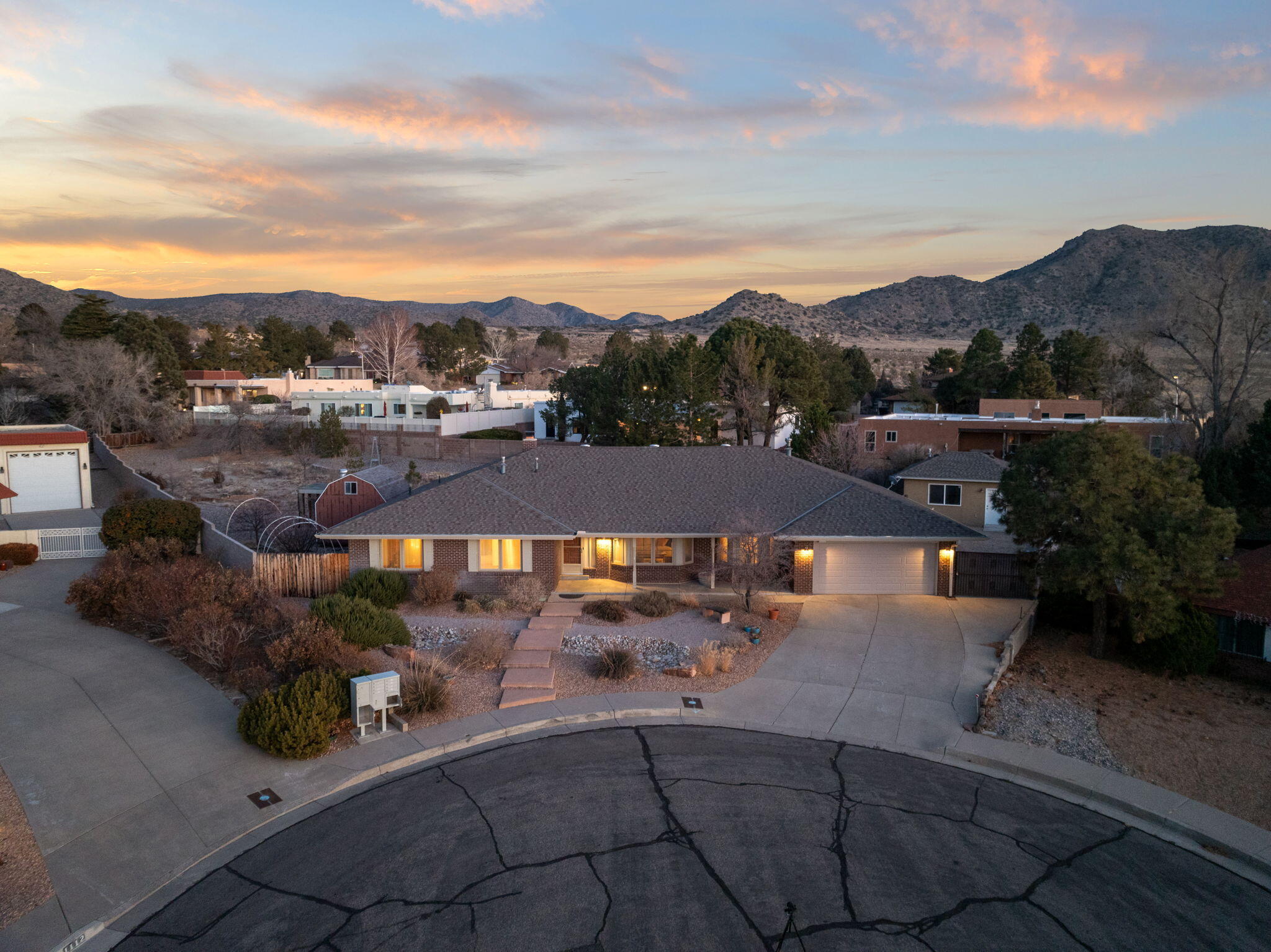 Four Hills Elegance! Timeless hardwoods and beautiful tile flow through this elegant midcentury home. The stunning great room, with its cathedral beamed ceiling and classic stone fireplace, is perfect for family gatherings. A chef's kitchen, complete with gas cooktop and stainless appliances, awaits. Two primary suites offer comfort for your loved ones. Outside, an impressive pergola over the large patio is the perfect extension of your home for entertaining. The oversized backyard on the .91-acre cul-de-sac lot brings so many possibilities. A versatile outbuilding presents many options - workshop, home office, art studio, or future! Recent roof work, Pella windows, and backyard access add to the upgrades. Come experience elevated living!