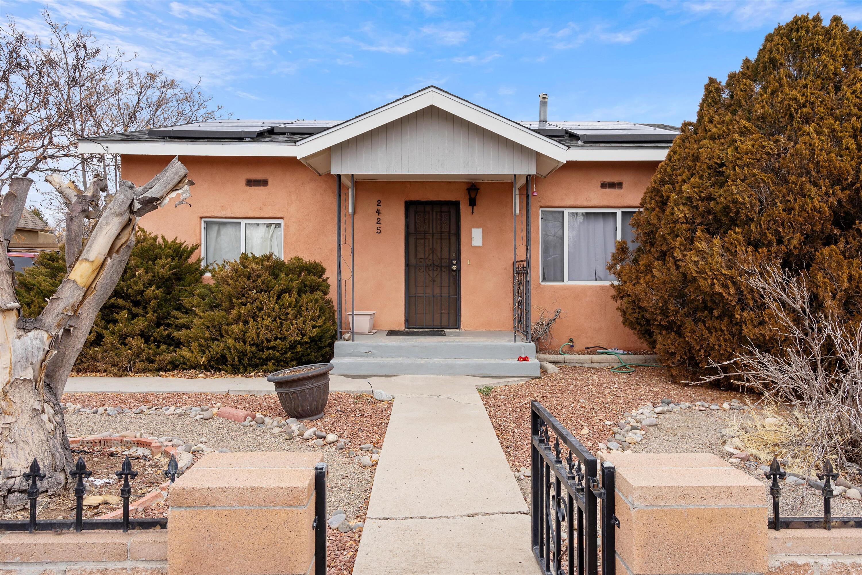 Discover an exceptional investment opportunity in the heart of historic Old Town Albuquerque! This charming duplex property boasts a main house with 3 bedrooms, 2 bathrooms, hardwood floors, and an open kitchen, paired with a detached 1-bedroom, 1-bathroom casita that's perfect for generating rental income. With virtually no vacancy in recent years and a strong monthly rent of $3,200, this property offers both stability and impressive cash flow. The casita features easy access with a wide driveway and an attached 1-car garage, making it ideal for tenants, guests.. Situated in a prime location, you're just steps away from the Albuquerque Aquarium, Tingley Beach, and the Natural History Museum, with Old Town's best dining, shopping, and entertainment minutes from your door. Act now!