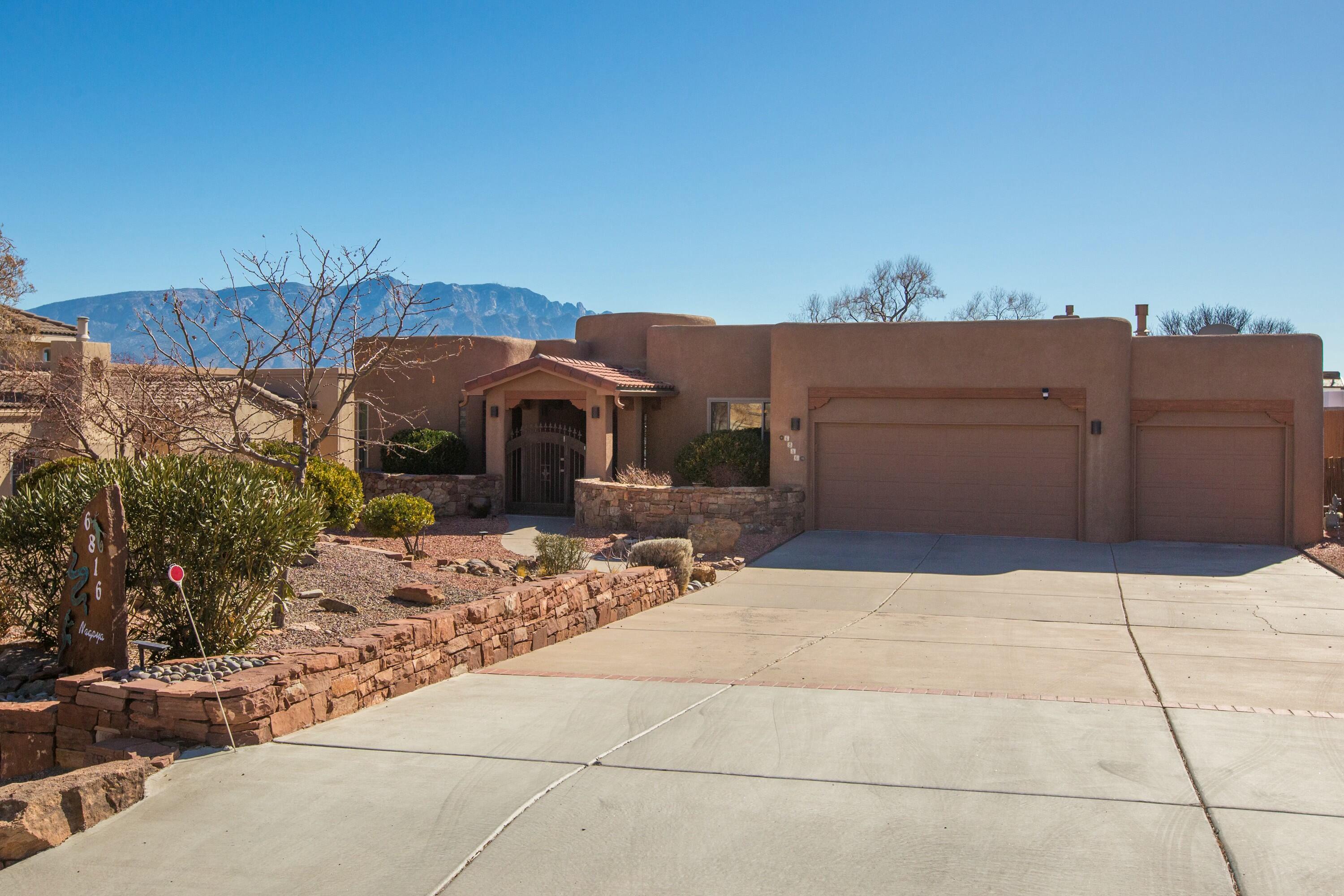 Custom single-level model home on a 0.5-acre lot with no HOA, offering privacy, views, and quality finishes. Radiant in-floor heat and refrigerated air ensure year-round comfort. The primary suite has scenic views, two walk-in closets, and a spa-like bath with jetted tub and snail shower. Bedroom 2 features a built-in desk and Murphy bed; Bedroom 3 is spacious. Second full bath includes double sinks. Living area has wood floors, gas log kiva fireplace, viga ceiling, and views. Kitchen offers granite counters, pine cabinets, and newer appliances. Outdoor features include a covered portal, flagstone patio, custom railings, dog run, Tuff Shed, and a finished oversized 3-car garage. New water heater in 2025.