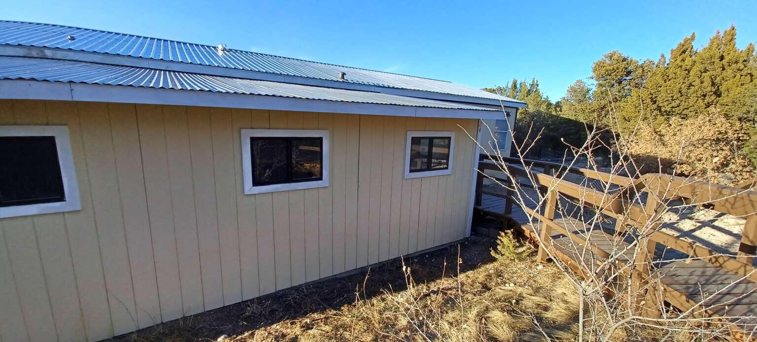 Full renovation nears completion on this 1700sq ft home sitting on 1/2 acre MOL. The location trades a short rocky road for peace and solitude away from it all. Huge amounts of cabinet storage. Comes with pellet stove, water softener, electric water heater, propane range and furnace. Enjoy the view and fresh air with both front and back decks. Garage 12'x28' and a shed 9'x8'. Money toward some close costs etc is possible. Edgewood city water. Permanent Foundation. It's approved as real property with Torrance County.