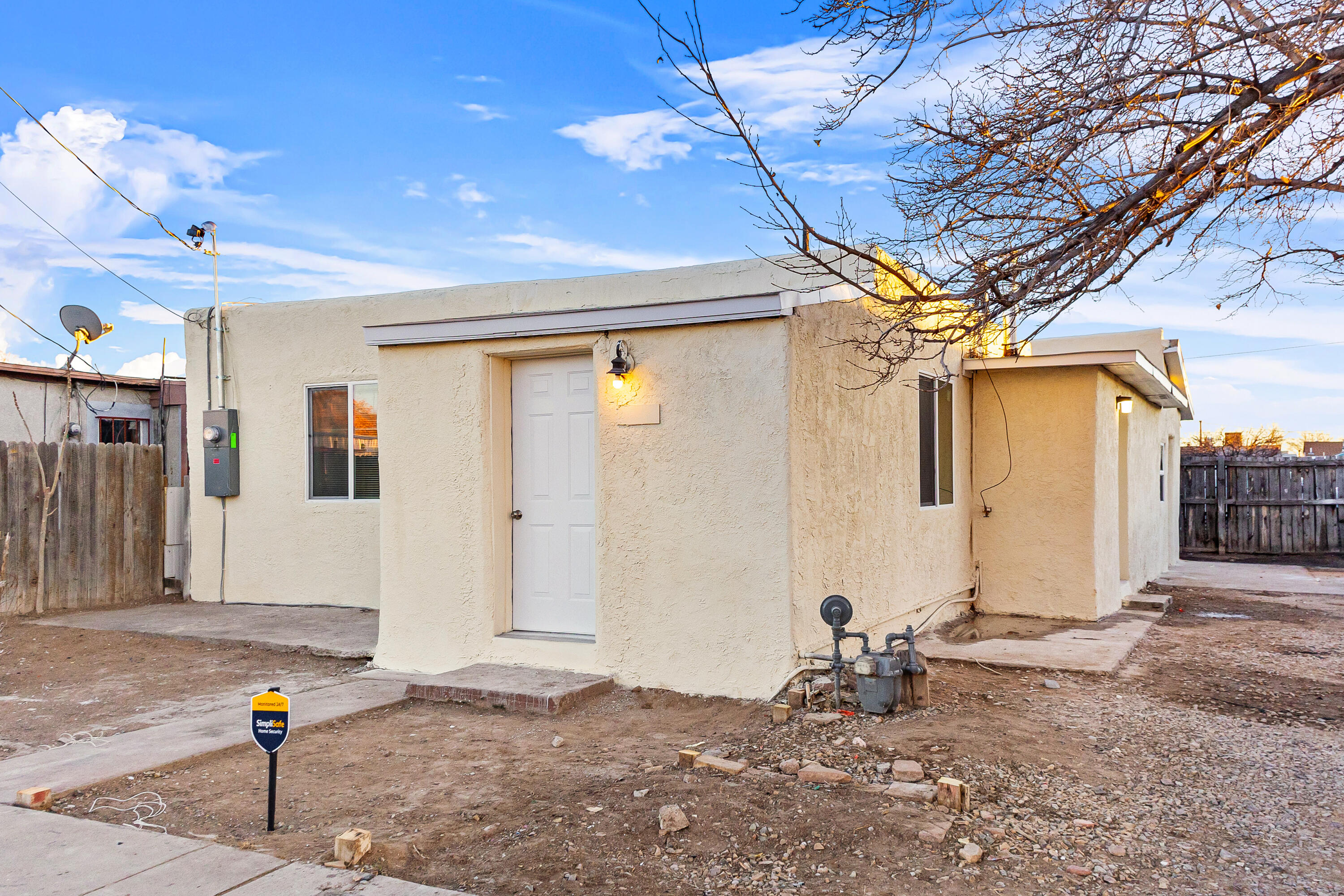 This beautifully updated home features striking blue walls, white marble countertops, and blue cabinets, creating a modern, stylish vibe. Located just minutes from downtown Albuquerque, it offers the perfect mix of convenience and charm.