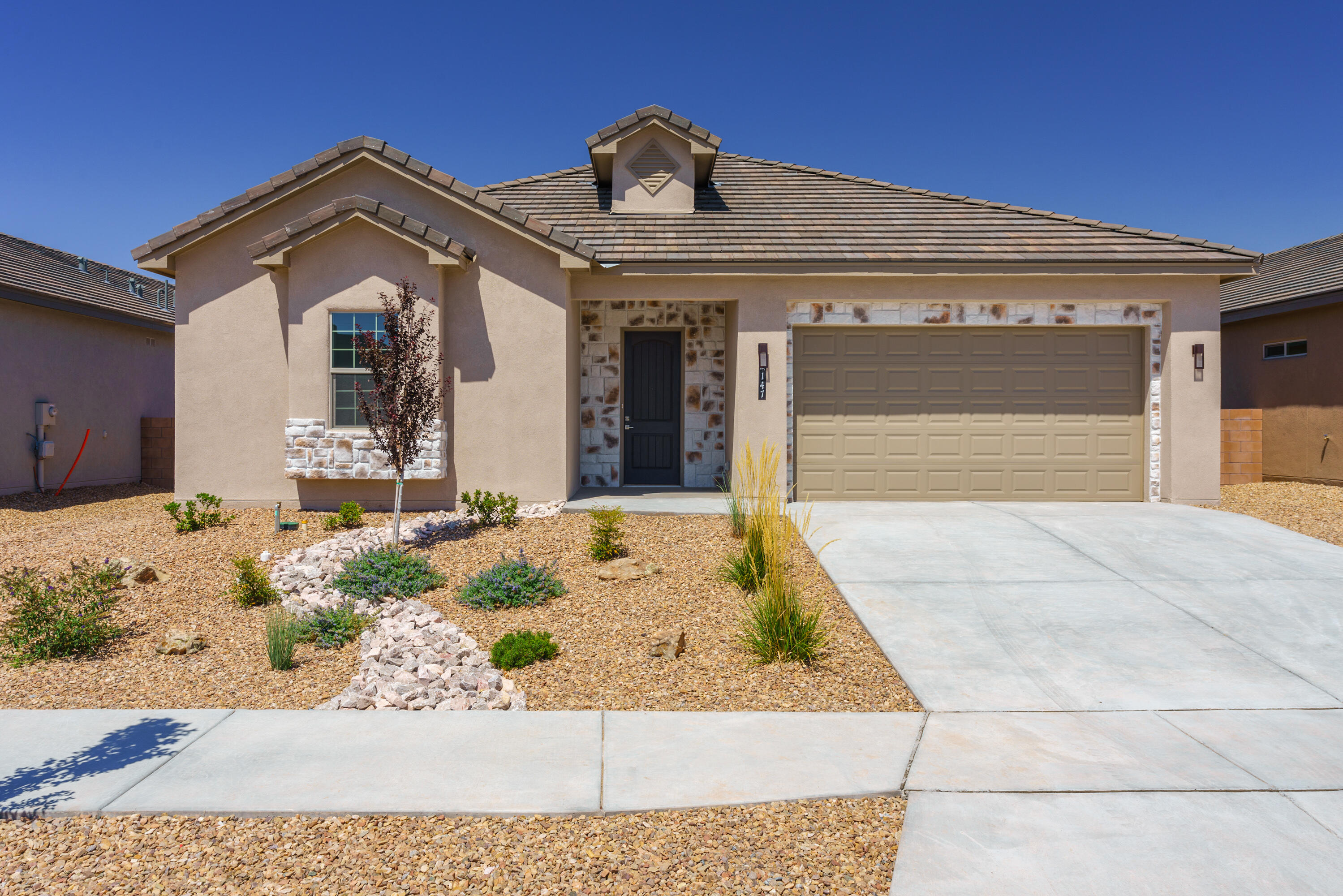 This beautiful new home is a rare find in the valley. Located in the quiet gated community of Lavender Fields in the North Valley, this spacious one-story features 4 bedrooms and 3 full baths. A spacious open floorplan perfect for entertaining or quiet nights at home. Features Hiigh-end appliances, very large island, custom tile work, and more. Front bedroom has private access to bathroom making it the perfect office or guest bedroom. A large covered patio is accessed through tall glass sliders. Primary bathroom has dual vanities, separate shower and separate tub. Coffered ceiling treatments in the primary bedroom and living room. This is the last new home in this lovely neighborhood so don't delay.