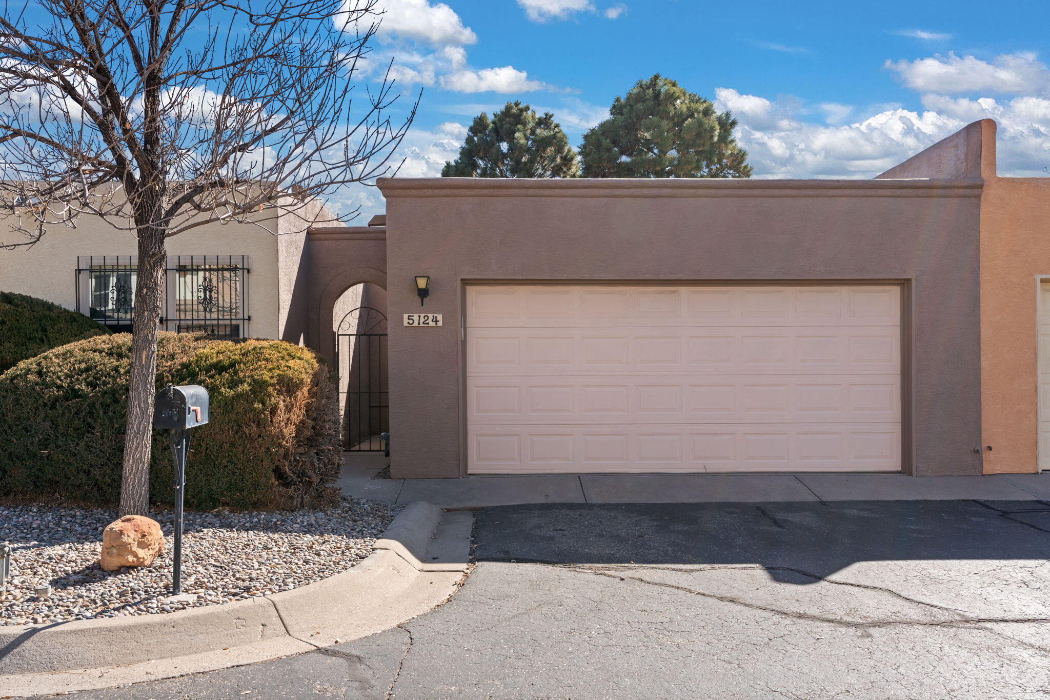 Just ADORABLE and updated 2-bed, 2-bath, 2-car townhouse in very desirable Northeast cul-d-sac location. Nestled just steps to the community pool, tennis courts, grassy open space, & club amenities! Inviting layout is sparkling clean and has fresh paint throughout. Bask in refrigerated air or cuddle in front of the cozy fireplace. Low-maintenance lifestyle in a well-kept community. You're just minutes from shopping, dining, medical, and more. Act fast, this home won't last long! Schedule a tour today with the 505-450-HOME Team today!