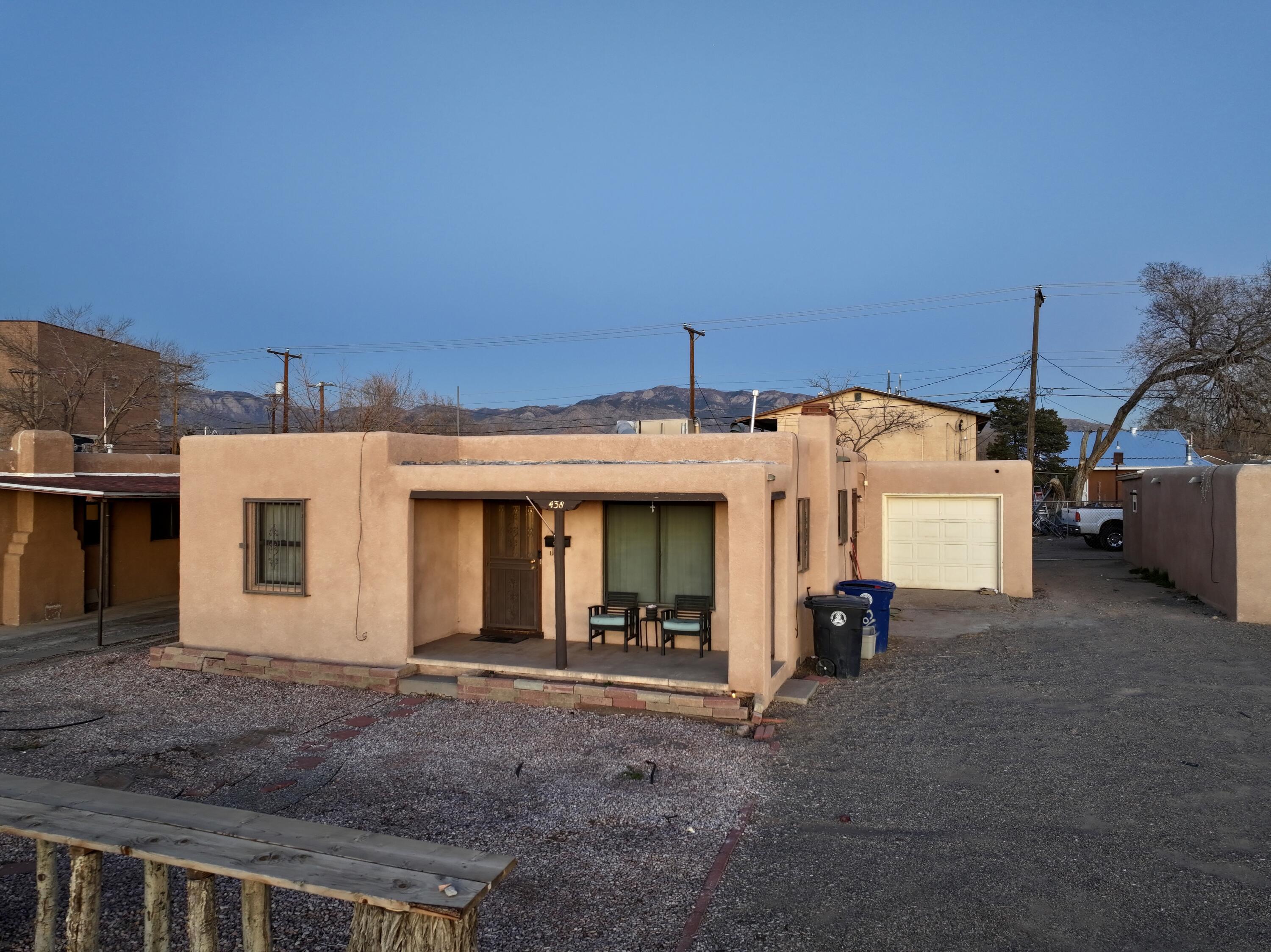 Welcome to 438 Louisiana Blvd NE, a charming 3-bed, 2-bath home with 1,215 sq. ft. of living space on a 6,969 sq. ft. lot. Built in 1947, it features a cozy fireplace, ceiling fans, and hardwood floors under select carpeting. The attached garage has plumbing, and a spacious service room offers ample storage. Less than a mile from Expo New Mexico, enjoy year-round events like the State Fair. Nearby, explore the Maxwell Museum, Meteorite Museum, and Tingley Beach. With easy access to Route 66 dining, shopping, parks, and public transit, this home offers unbeatable convenience in the heart of Albuquerque.