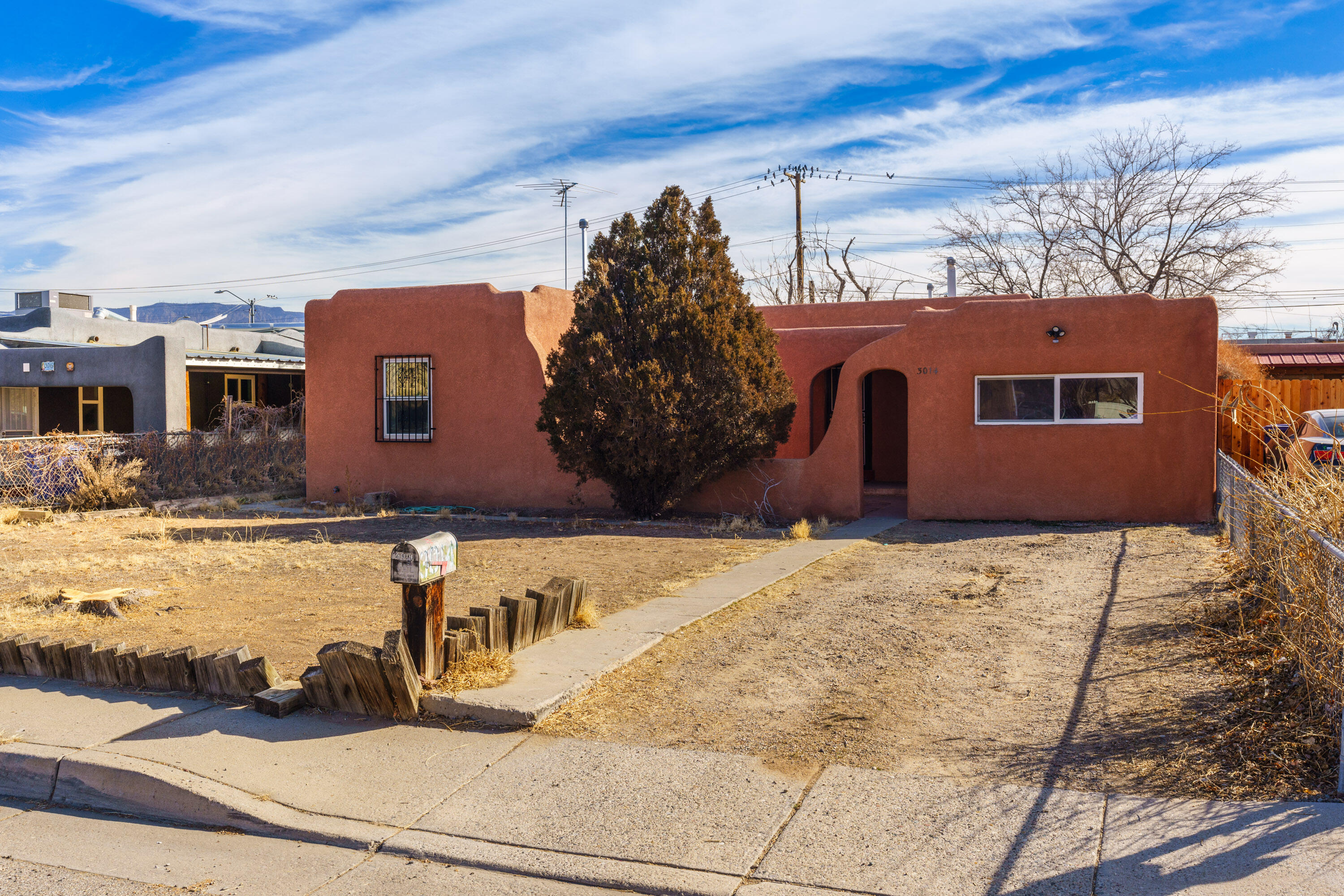 Classic ABQ bungalow awaits your personal touch! A charming front courtyard invites you into a home featuring cove ceilings & original hardwood floors waiting to be restored. The kitchen includes original cabinets, offering a great foundation for updates. With no carpet anywhere in the house, the space feels open & ready for customization. A sunlit office w/ built-in shelves makes for a perfect workspace, while a spacious family room offers endless options. The cozy living room flows into a separate but open dining area, perfect for gatherings. Double-pane windows help keep the home warm & quiet, and fresh paint throughout brightens every room. The large backyard is ready for you to create your ideal outdoor retreat. This is your chance to transform a classic into your dream home!