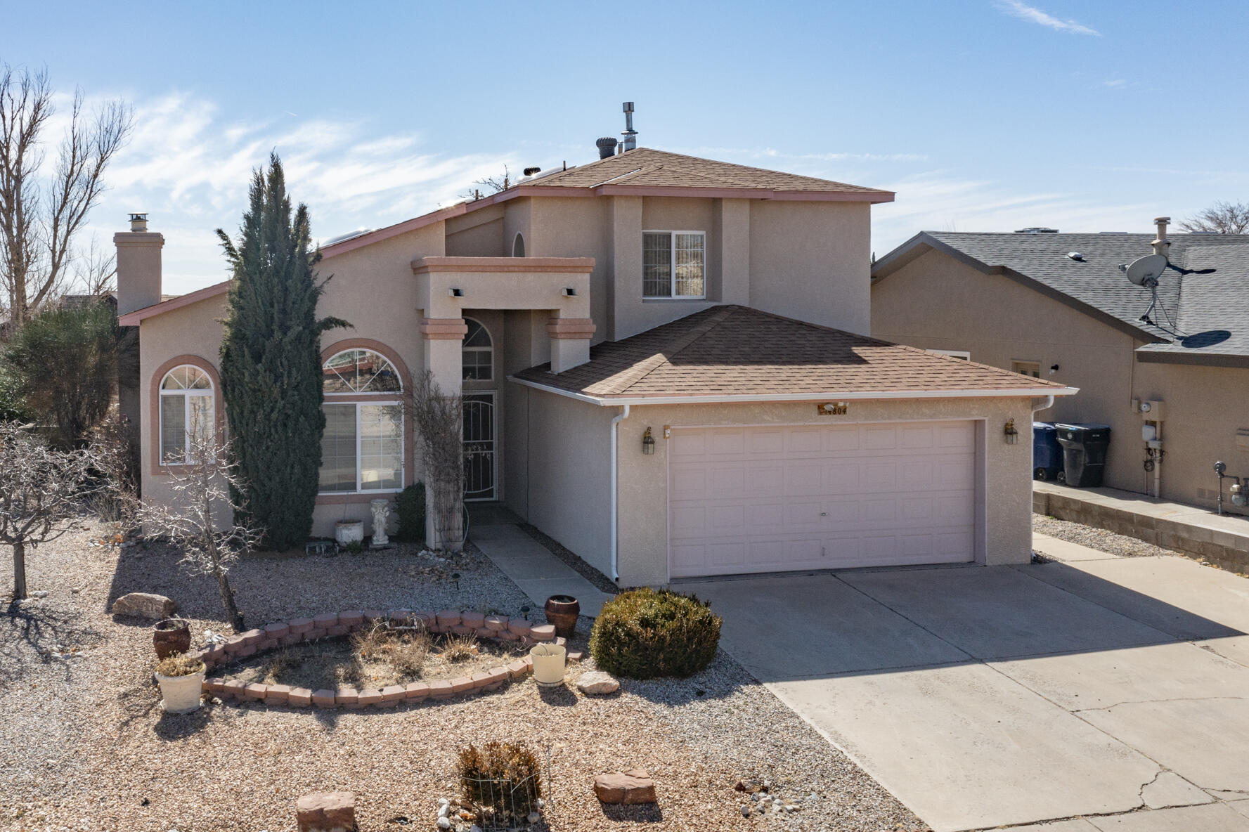 This wonderful home is spacious with high ceilings, featuring ceramic tile and laminate flooring downstairs. The kitchen has a breakfast nook, an abundance of cabinets along with solid surface counters and is open to the living room. Embrace the family-oriented layout featuring two living areas. The large living area has laminate wood flooring, high ceilings and an energy efficient pellet store. There is an office area which leads to the finished sunroom which is heated and cooled. The primary bedroom with a large sitting room flows to a balcony where you can enjoy a cup of Joe at daybreak or a beverage during the stunning sunsets. The primary bath has double vanities, a jetted tub and huge walk-in closet. There are 2 additional spacious bedrooms, one upstairs and one down with both havin