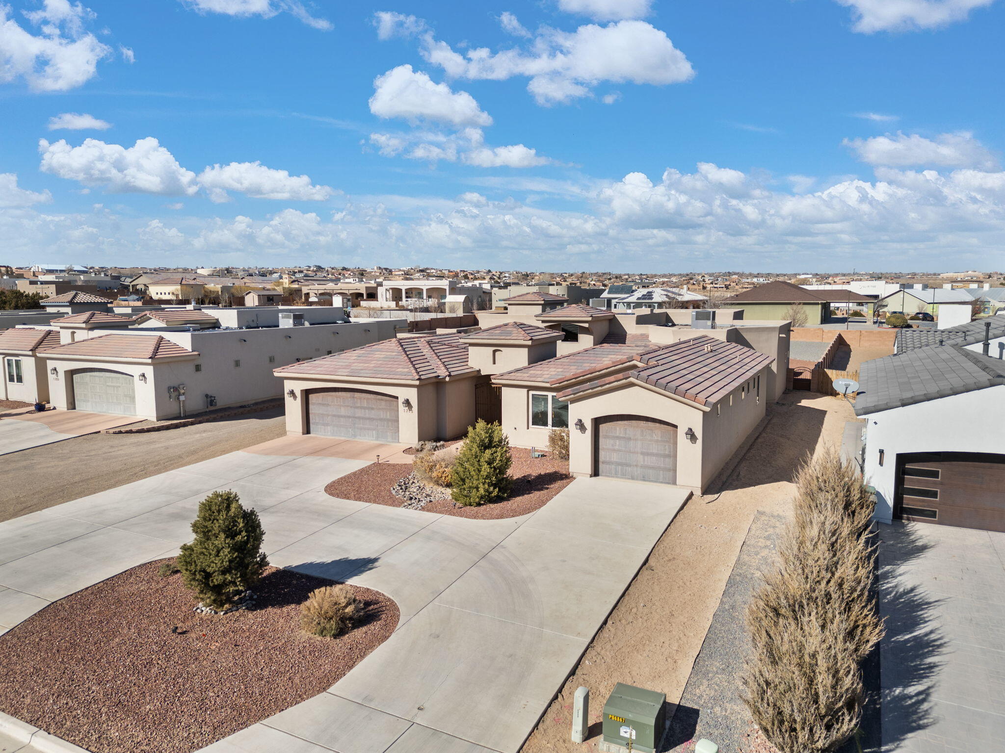 Built by the renowned, award-winning PS Custom Homes, this exceptional home with a casita wing is nestled in one of Rio Rancho's most desirable neighborhoods, surrounded by stunning custom homes and just minutes from Albuquerque. Perfectly located within a top-rated school district and near RUST Medical Center, shopping, restaurants, and family entertainment, this home offers the perfect blend of convenience and luxury. Thoughtfully designed with energy efficiency (owned solar) in mind, this superior home boasts a welcoming open floor plan, generously sized bedrooms with walk-in closets, and a spectacular gourmet kitchen featuring an oversized baker's pantry.