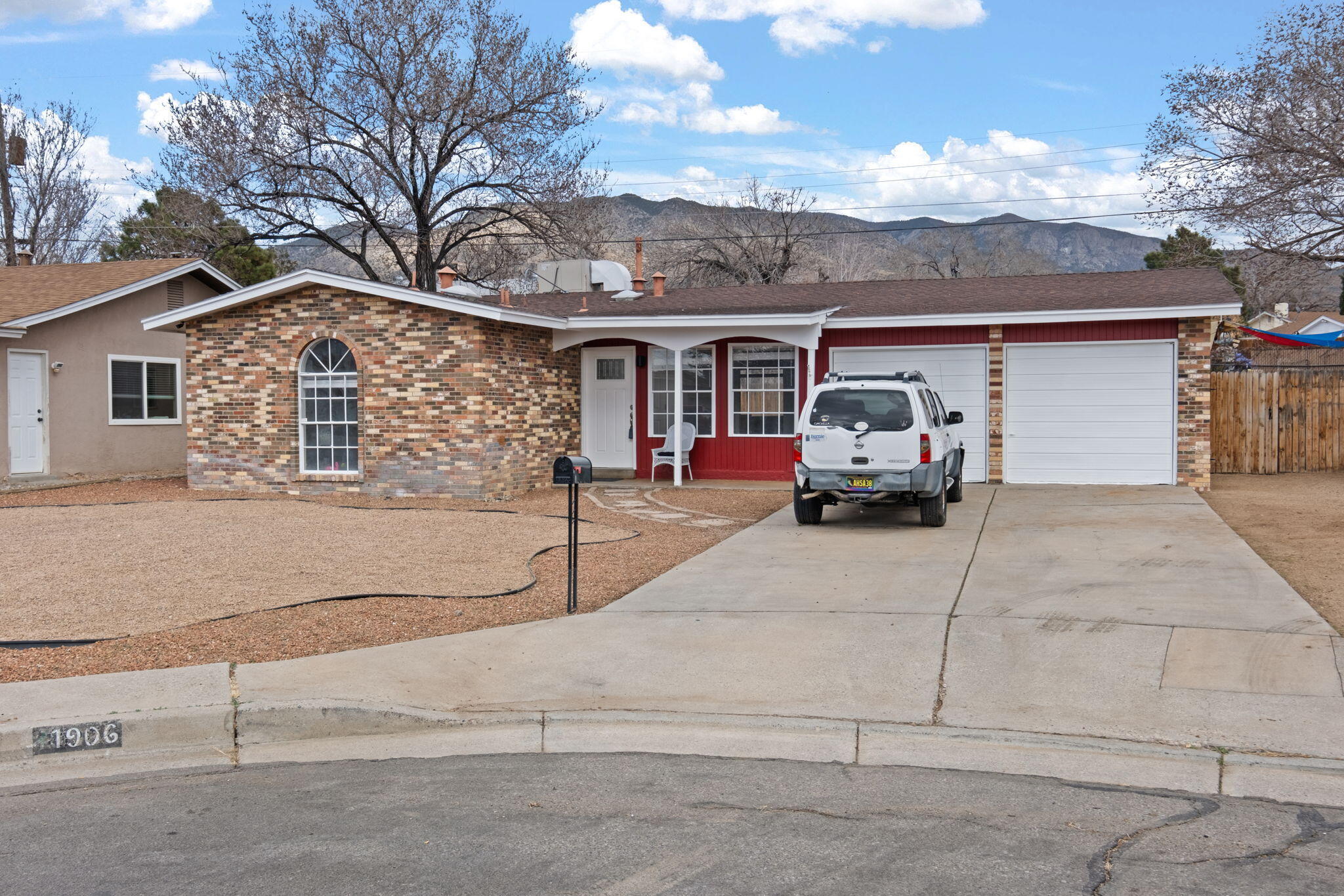 Single story three bedroom, 1 3/4 bath Northeast Heights Gem located in a quiet cul-de-sac with gorgeous mountain views!  Enjoy NEW luxury laminate flooring, NEW window treatments, fresh gravel in front, freshly painted interior & exterior, NEW ceiling fans, NEW light fixtures, and so much more.   Lovely location, providing easy access to  Shopping, Restaurants, and Schools.