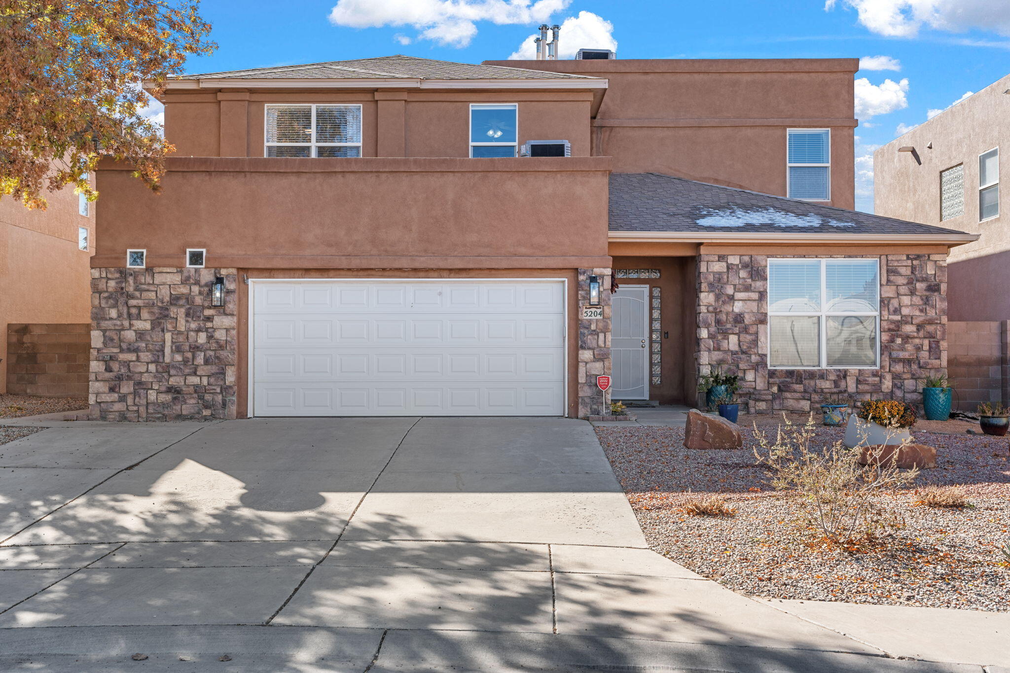 Nestled in the heart of convenience, this home is perfectly situated near top restaurants, a hospital, and shopping, with easy access to both Albuquerque and Rio Rancho. Stone Mountain is tucked away in a quiet cul-de-sac, offering the added benefit of OWNED SOLAR PANELS to keep your energy costs low! Enjoy the community amenities, including a sparkling swimming pool and lush parks.Step inside to discover a grand entryway leading to a spacious living room, with soaring ceilings that create an open and airy atmosphere throughout the kitchen and family room. A cozy downstairs bedroom and full bath are perfect for guests, while upstairs you'll find four generously-sized bedrooms plus a bonus game room for endless entertainment!