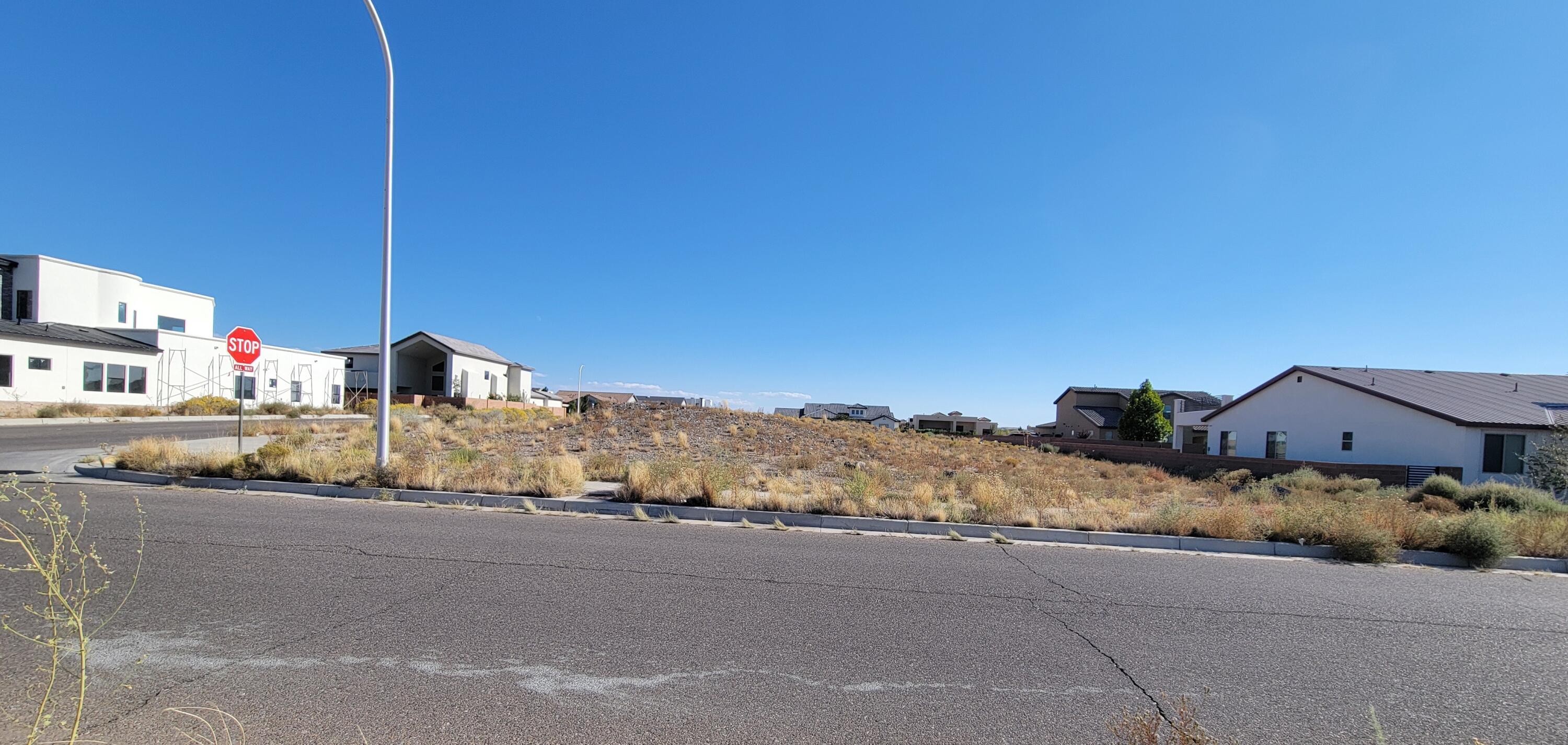 Imagine crafting your dream home atop the magnificent volcano cliffs area. You can design your perfect sanctuary without any limits; take the leap and turn your vision into a reality on this corner lot with spectacular views of the Sandia Mountains. Easy access thoroughfares Unser Blvd and Paseo del Norte. Utilities are already in the street! SAD is paid in full.