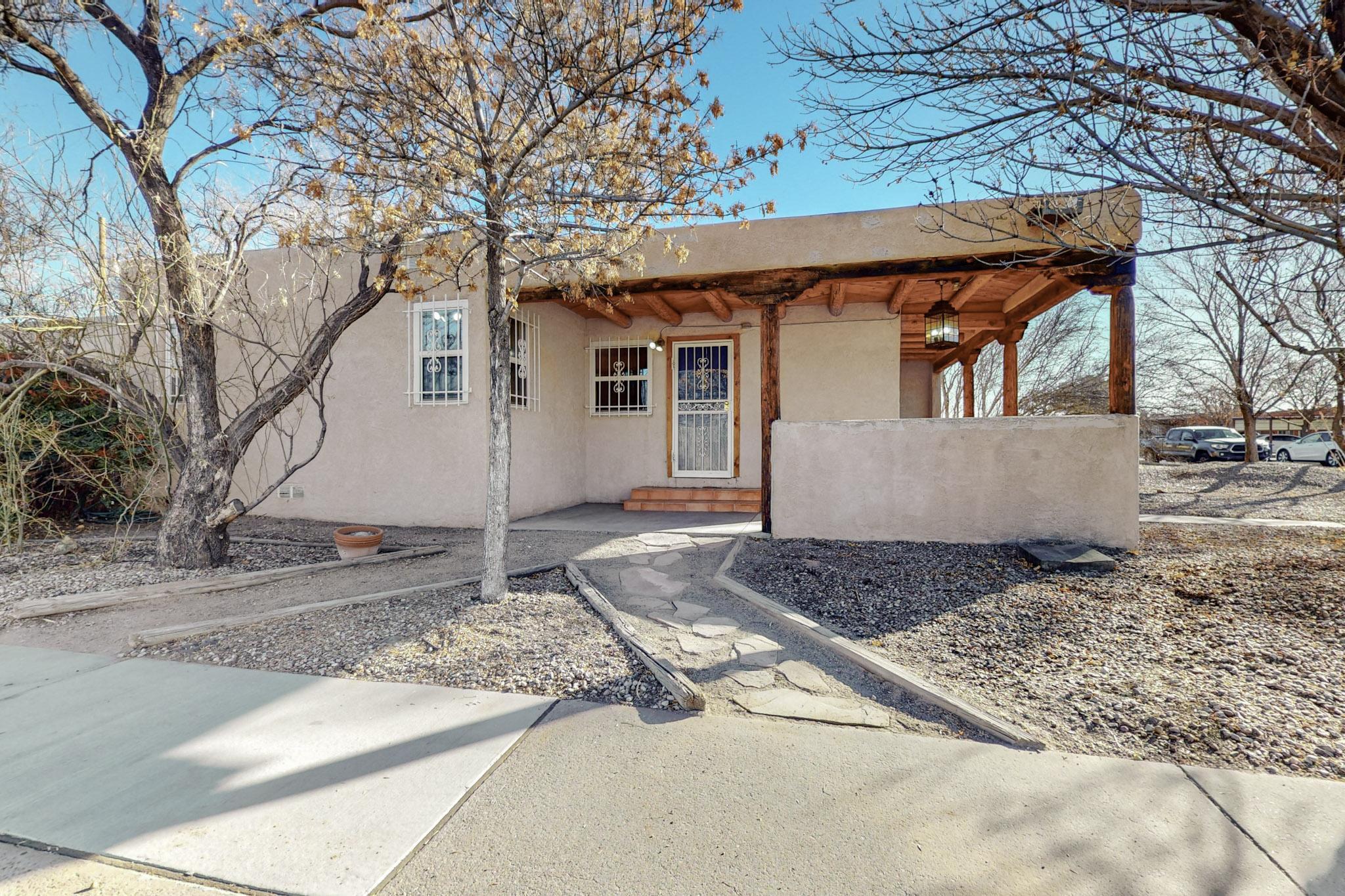 Great home in the Ridgecrest neighborhood area. Recent updates including paint, bedroom carpet, ceiling fans, new kitchen sink, updated electrical 11/2024, new sewer line from home to street and cleanouts 12/2022,  new screens 10/2024, and 60 mil TPO roof 10/2022 with transferrable warranty (fee required / negotiable). Updated double pane vinyl windows and 5 skylights to keep things nice and bright! 4 spacious bedrooms, 2 living areas, nice Tough Shed and back yard access as well! Come see this comfy home today with easy access to the Base, UNM, downtown and the airport!