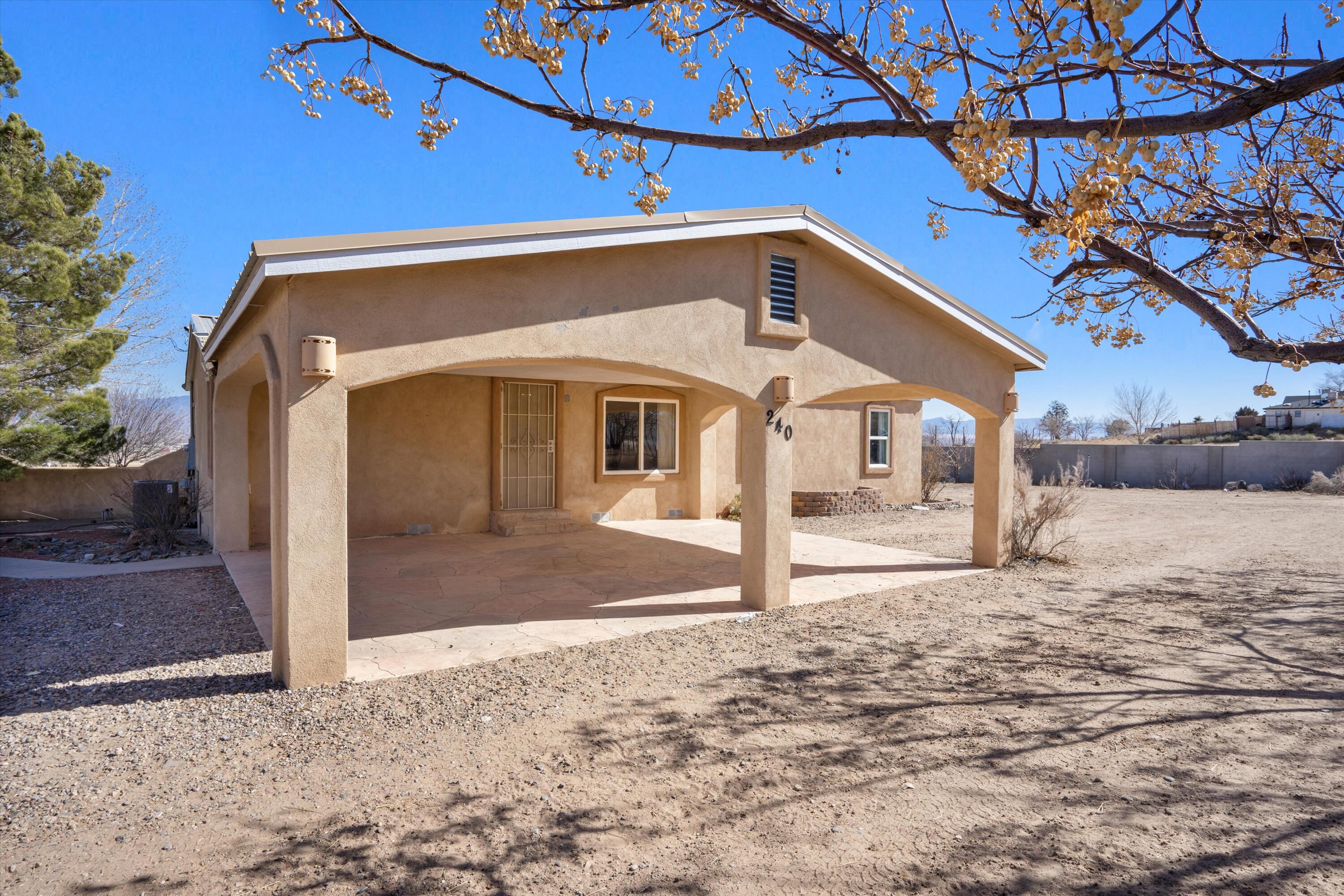 Sitting on a 1-acre lot this home offers so much opportunity and amenities! The yard has an electric gate,  carport, enclosed landscaped back yard with a fireplace and outdoor kitchen, storage unit,  and backyard access. The interior offers a renovated kitchen and bathrooms, open and bright floor plan. Windows are upgraded and cooling is refrigerated. Just minutes away from I40, shopping and restaurants this is an amazing opportunity!