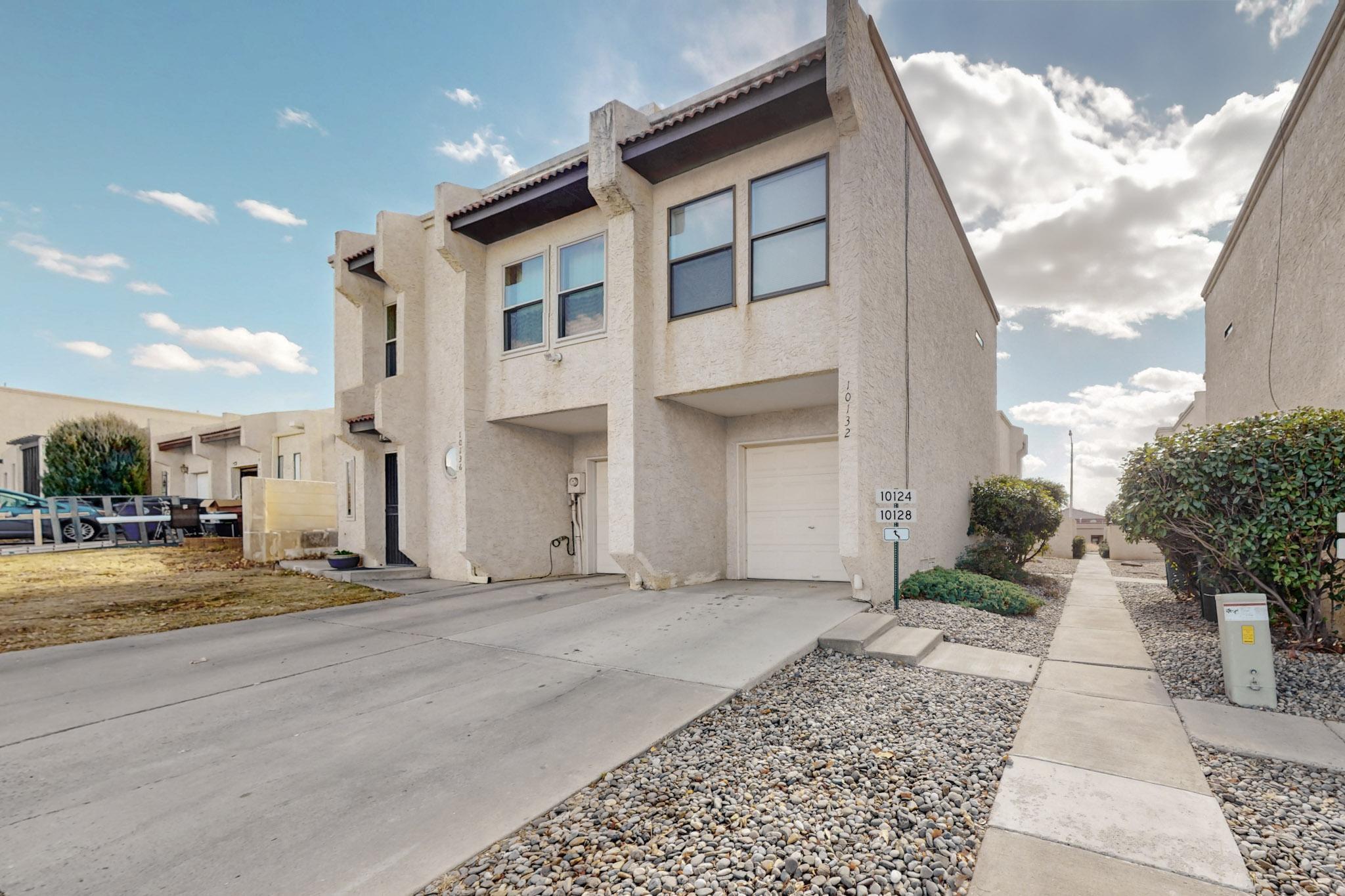 Welcome home to this charming 3-bedroom, 3-bathroom townhome in the heart of Northeast Heights, conveniently located within the Eldorado High School District. As you step inside, you'll appreciate the light and bright layout, highlighted by fresh paint and plenty of natural light. Upstairs are three roomy bedrooms and two full bathrooms, while the lower level features the kitchen, a laundry room, and a convenient half bath. You'll love having your very own one-car garage and a cozy private backyard patio with a gas fireplace and built-in seating for those fun evenings outside. With its central location near schools, shopping, dining, and breweries, this townhome offers the perfect blend of comfort and convenience. Move-in ready!!!